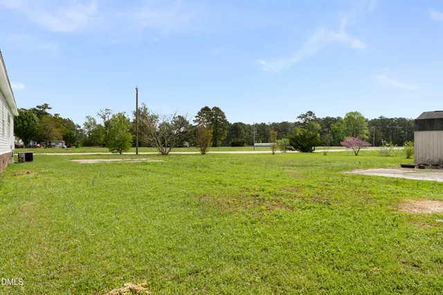 a view of a house with a big yard