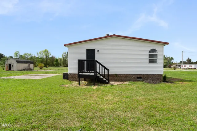 a backyard of a house with lots of green space