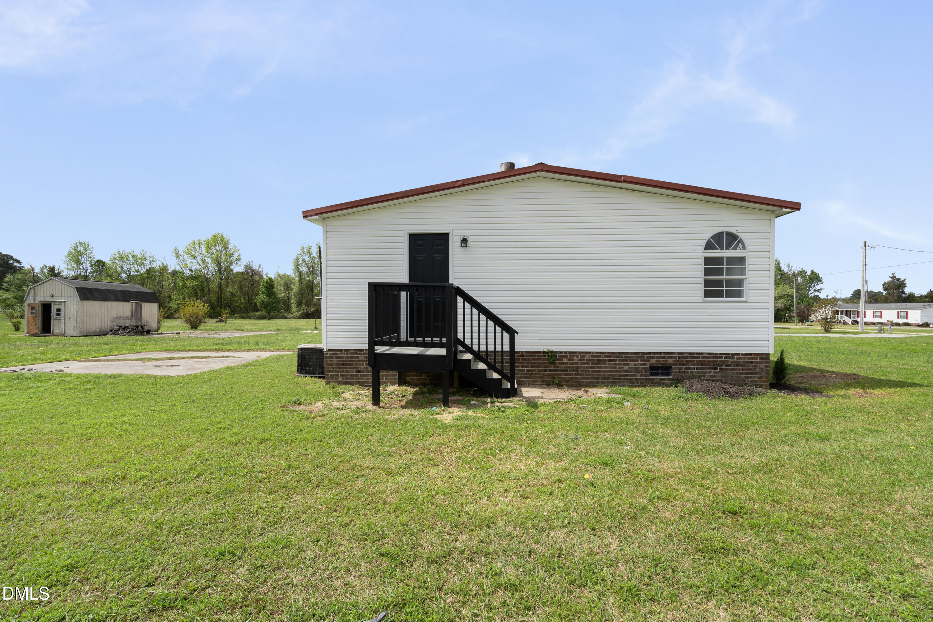2048 Town Crier Road Kinston, NC 28504 - Photo 44 of 48 a view of a house with backyard