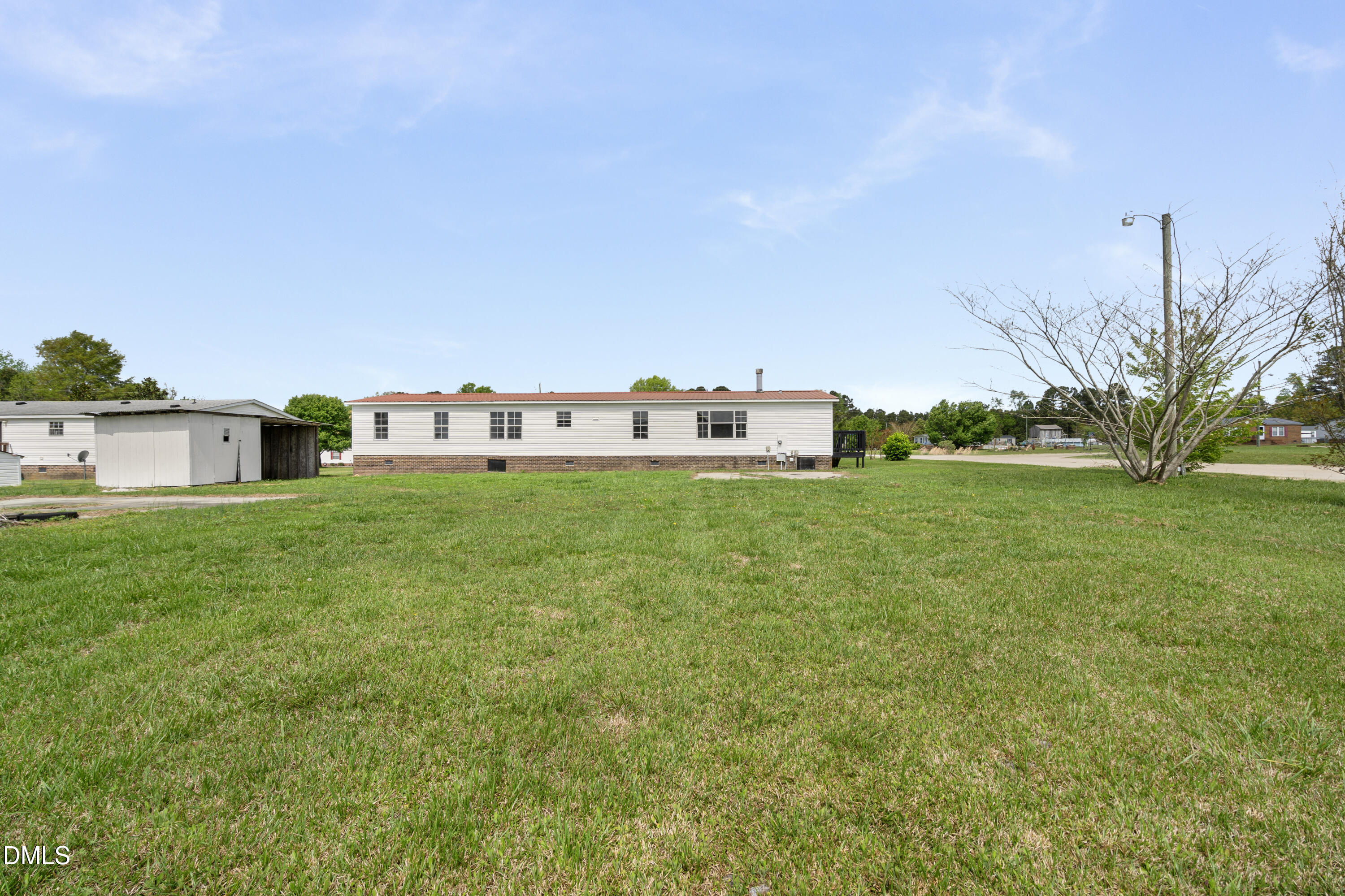 2048 Town Crier Road Kinston, NC 28504 - Photo 45 of 48 a view of a house with a big yard