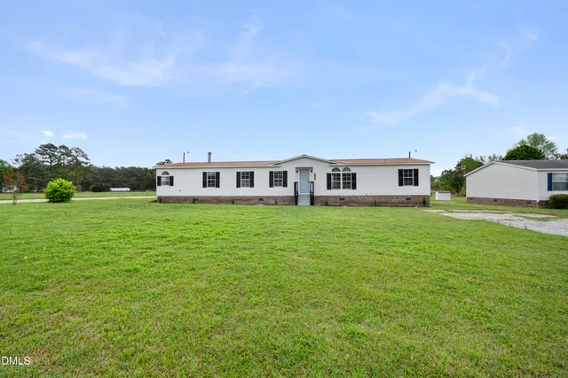 a view of a house with a big yard