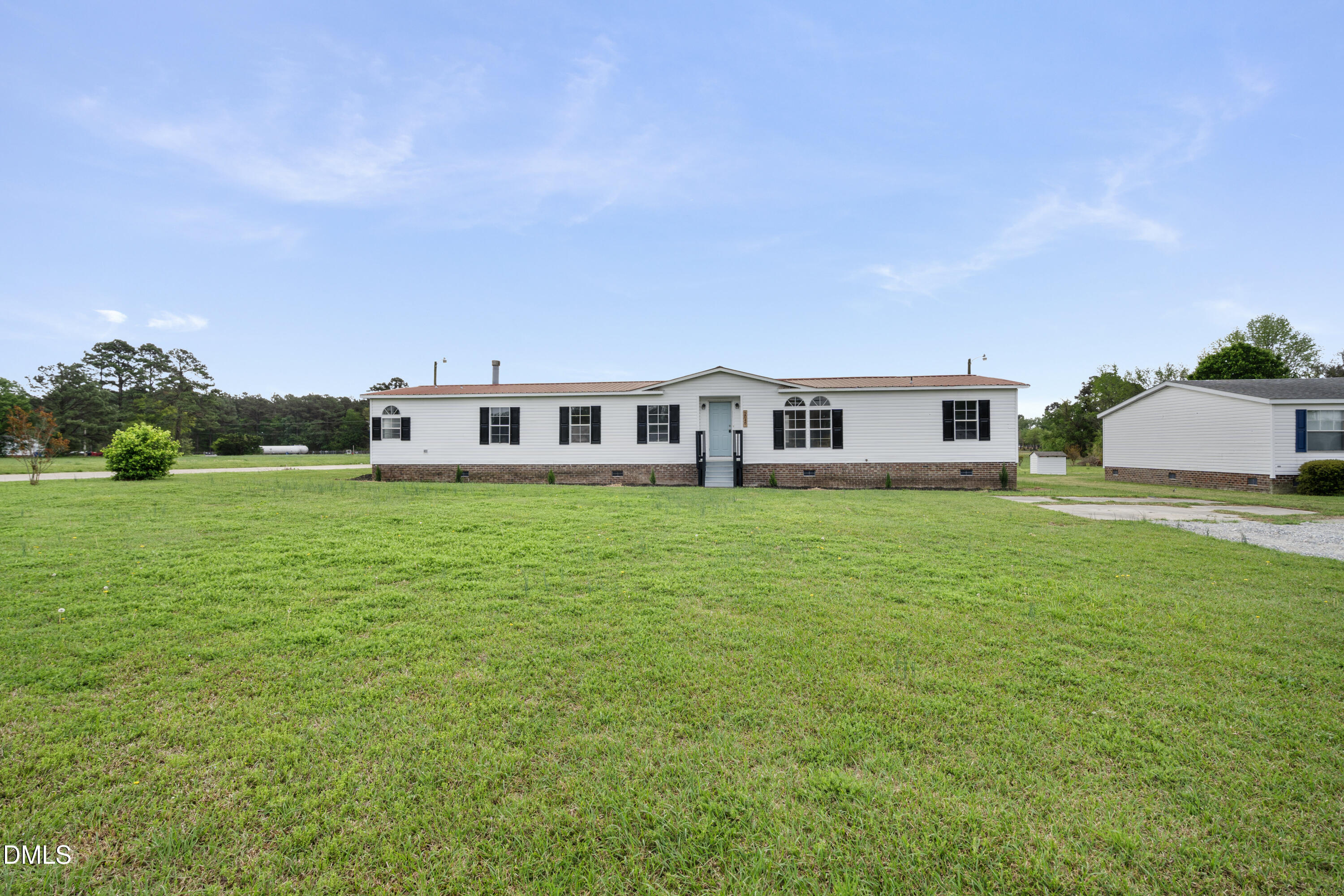 2048 Town Crier Road Kinston, NC 28504 - Photo 7 of 48 a view of a house with a big yard