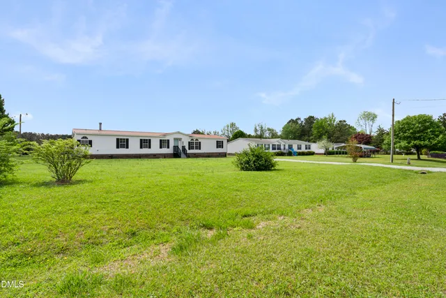 a view of building with outdoor space and garden