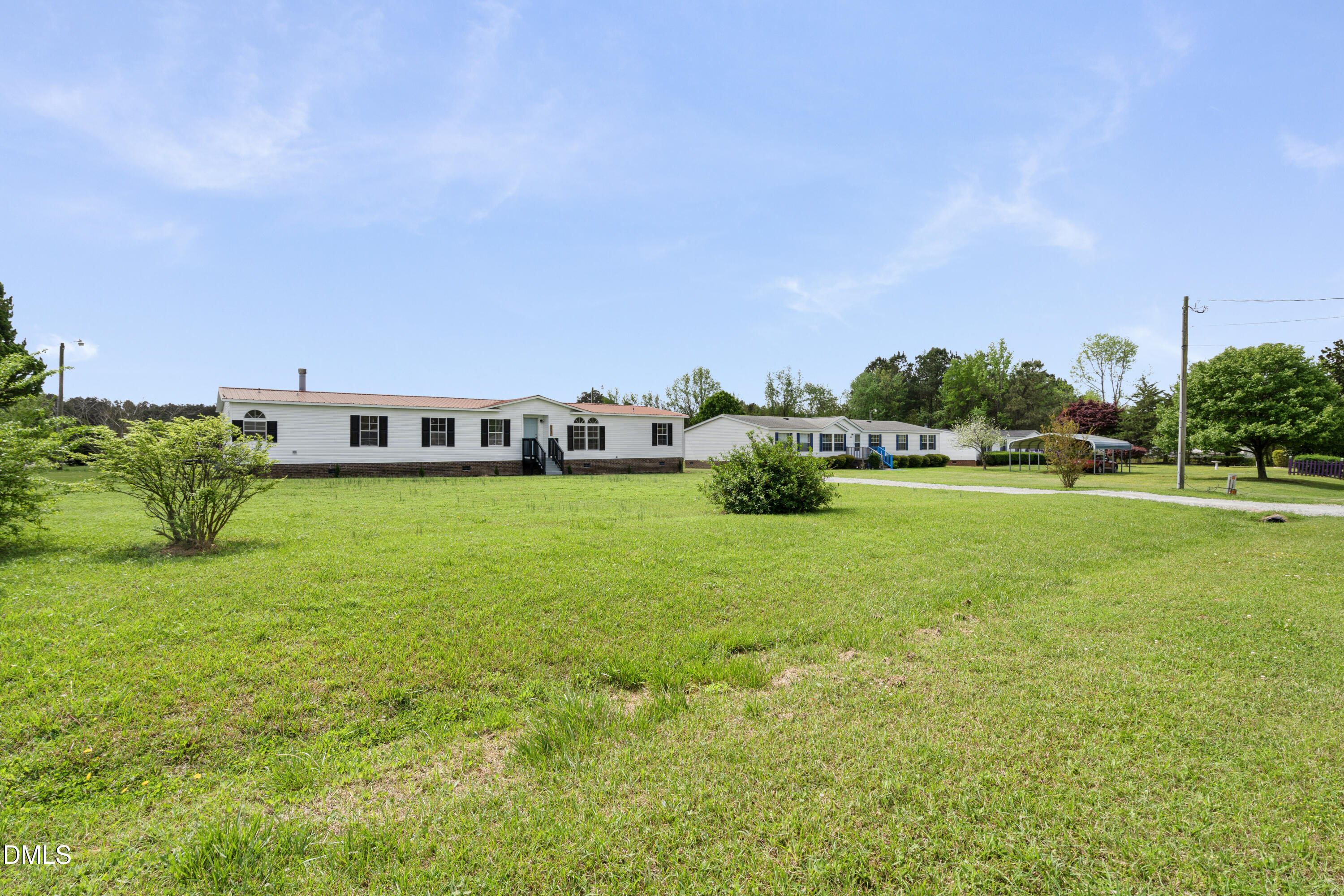2048 Town Crier Road Kinston, NC 28504 - Photo 8 of 48 a view of building with outdoor space and garden