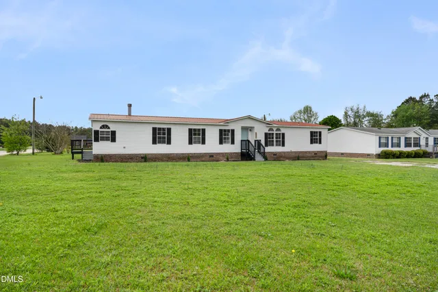 a view of a house with a big yard