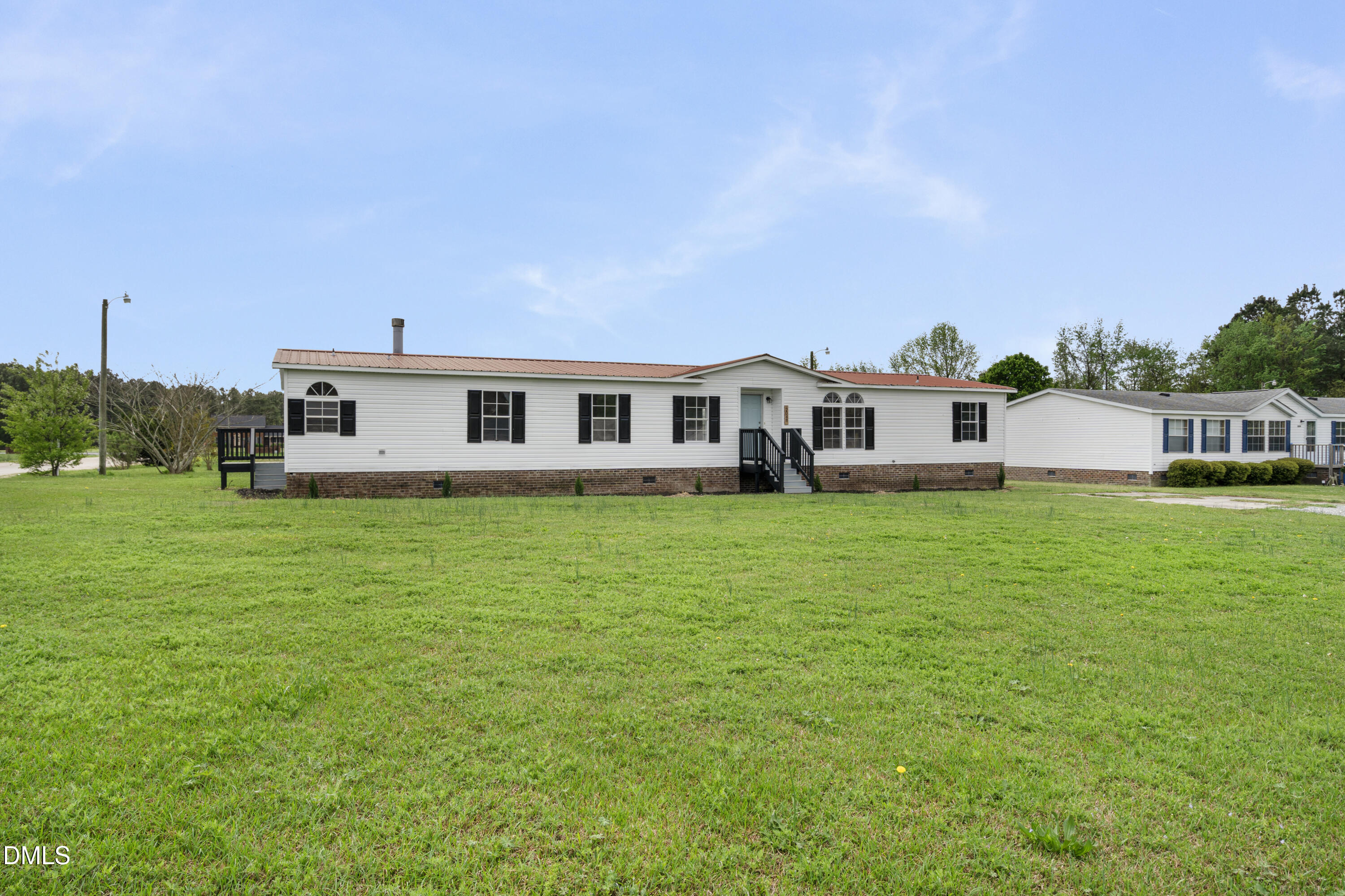 2048 Town Crier Road Kinston, NC 28504 - Photo 9 of 48 a view of a house with a big yard