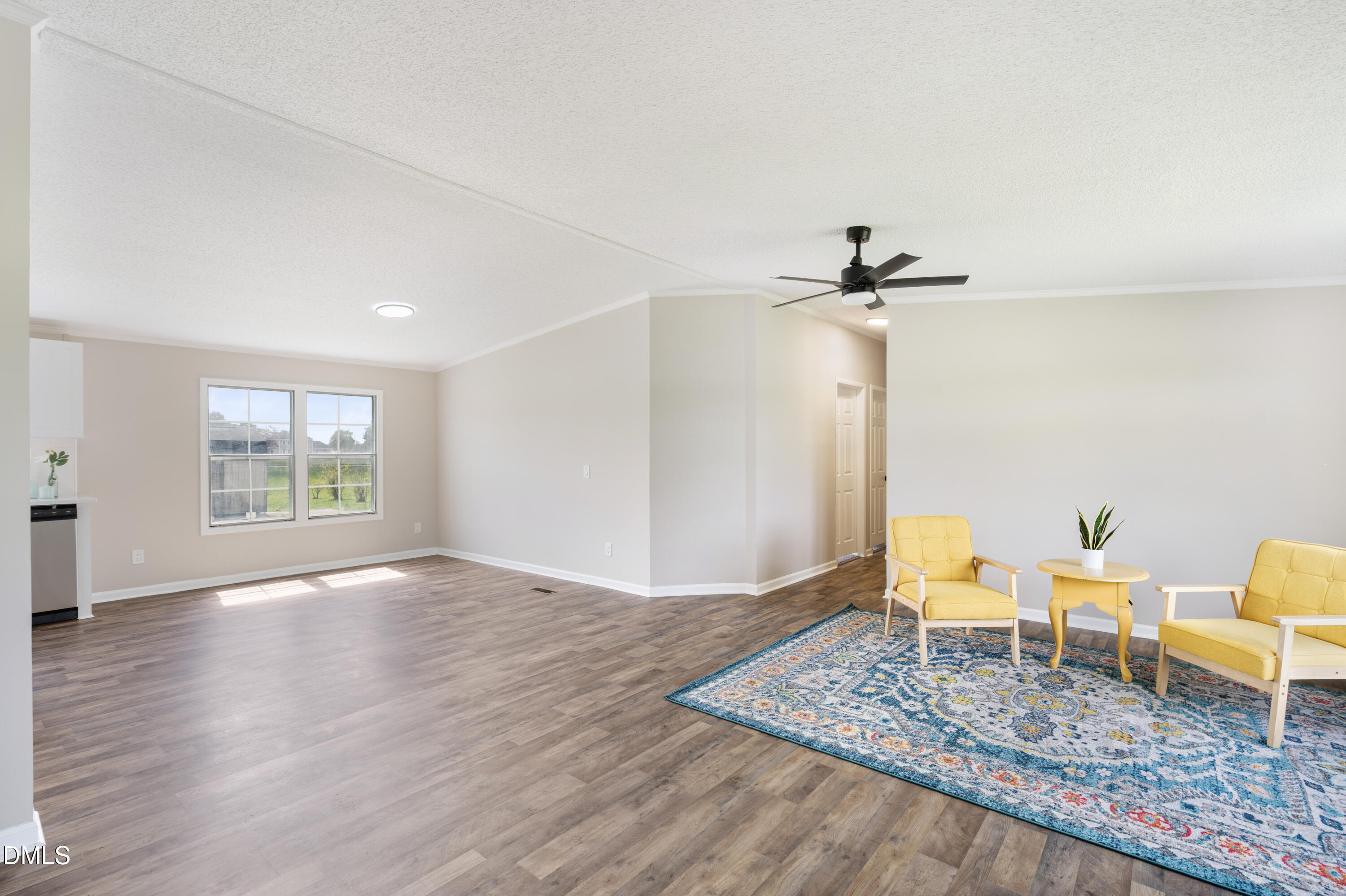 2048 Town Crier Road Kinston, NC 28504 - Photo 10 of 48 a view of an empty room with a window and wooden floor