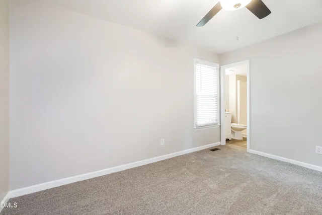 an empty room with a empty space and a window