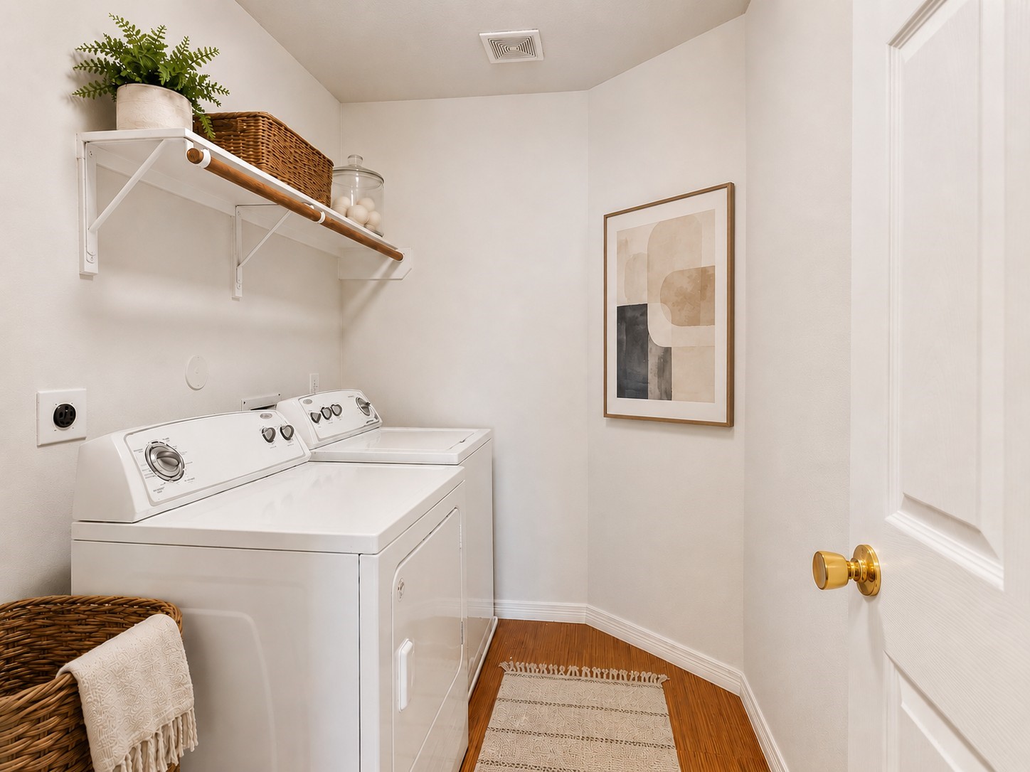 19422 Harvest Stream Way Houston, TX 77084 - Photo 32 of 41 The laundry room is located upstairs near the primary suite and includes convenient shelving for storage. AI-staged to help visualize the space.