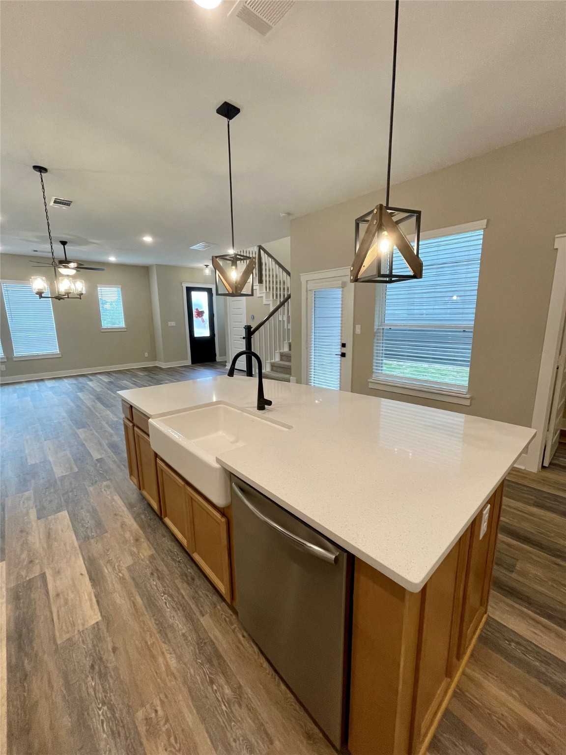 18607 Courteous Way Cypress, TX 77433 - Photo 15 of 37 a kitchen with kitchen island a sink and wooden floor