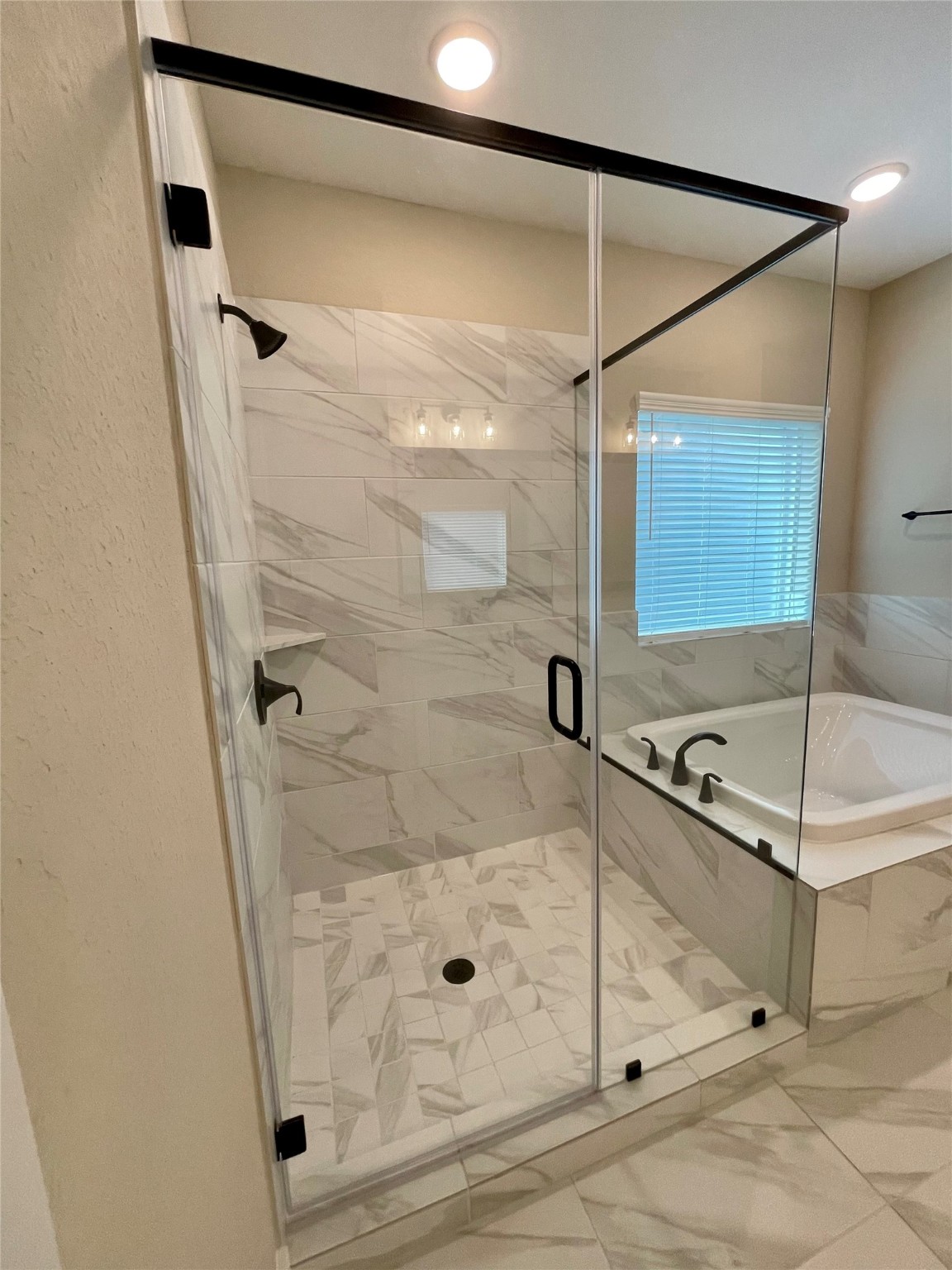 18607 Courteous Way Cypress, TX 77433 - Photo 24 of 37 a bathroom with a shower and a mirror