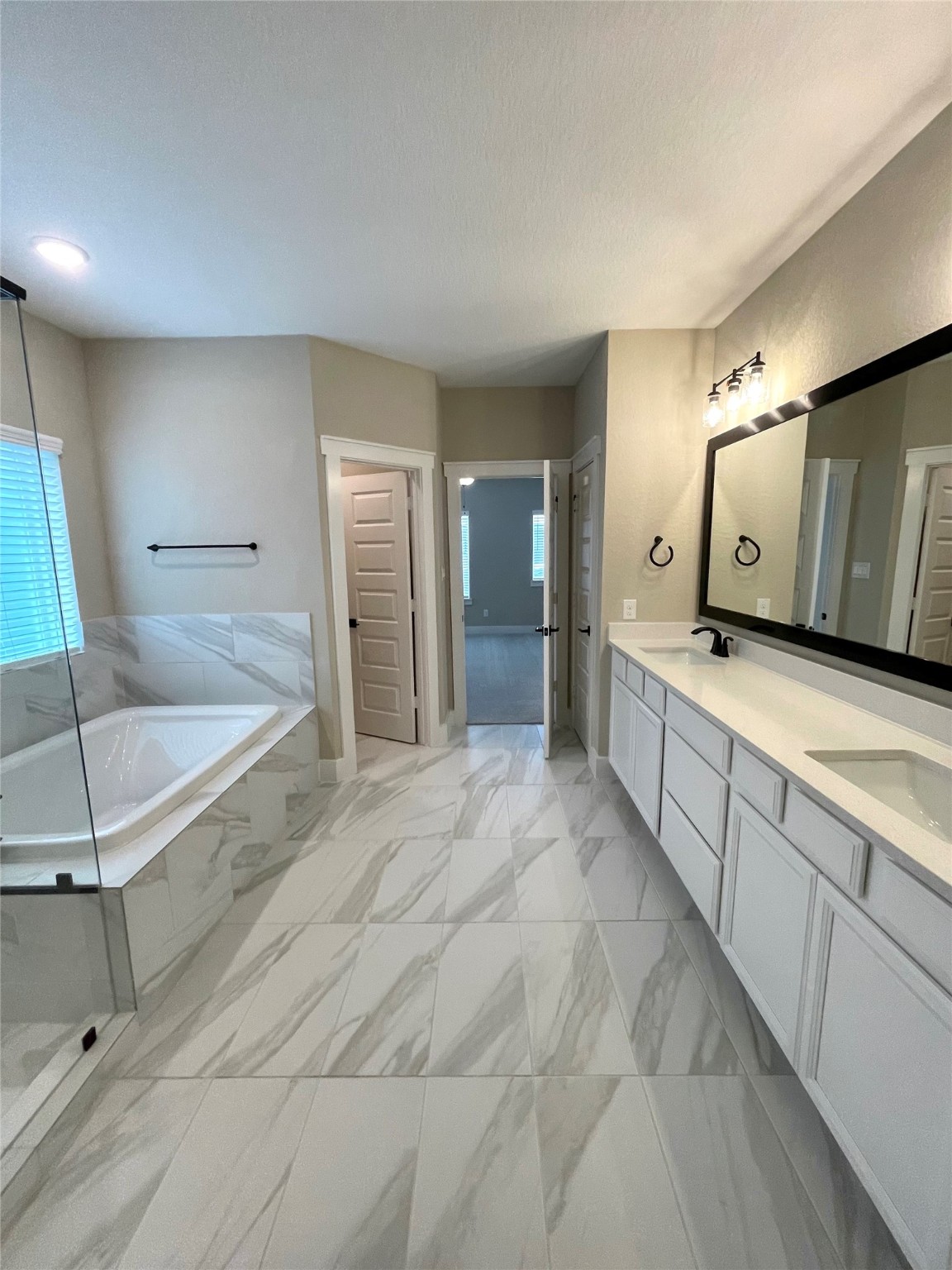 18607 Courteous Way Cypress, TX 77433 - Photo 25 of 37 a large spacious bathroom with a large tub and shower