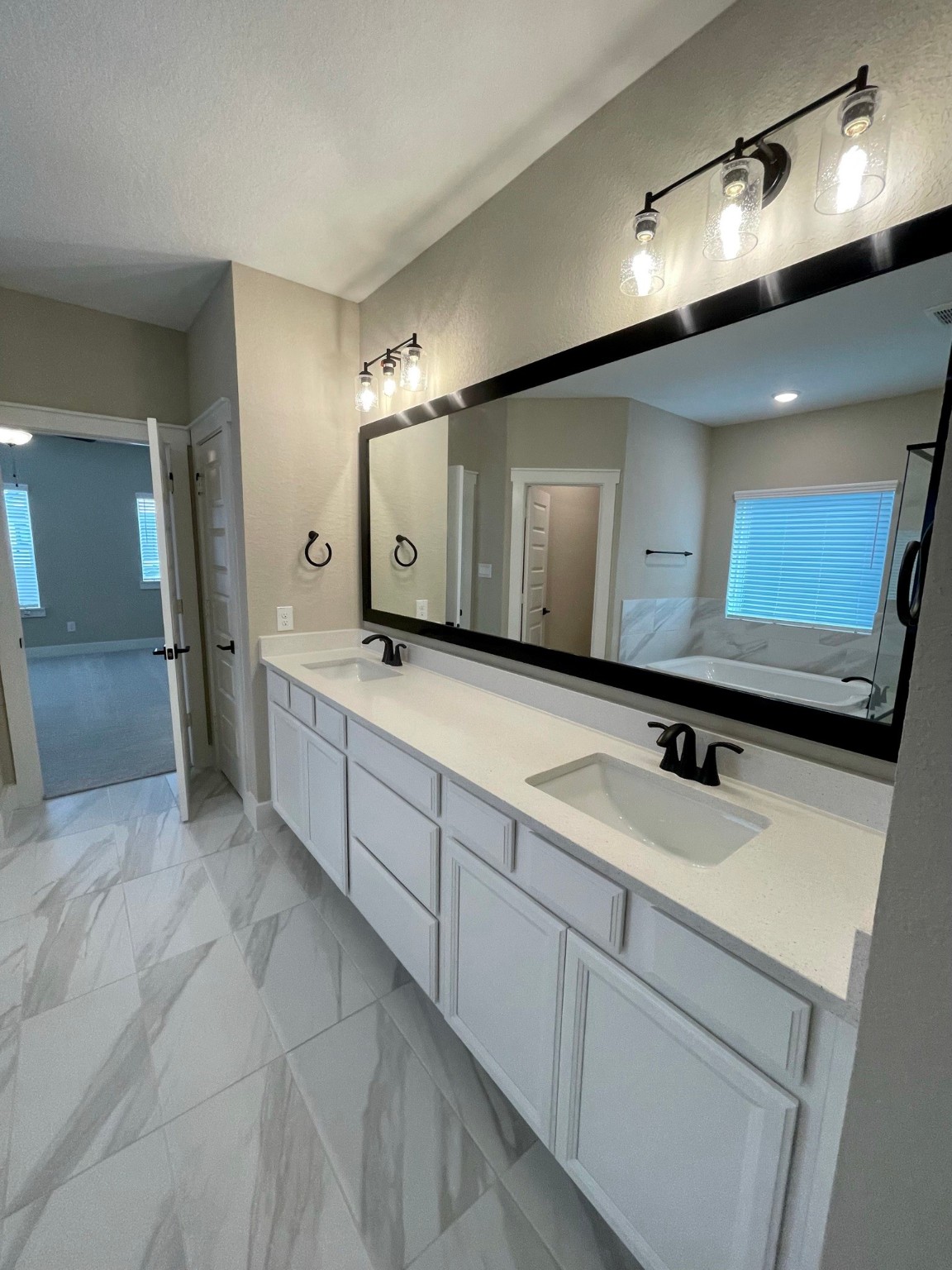 18607 Courteous Way Cypress, TX 77433 - Photo 26 of 37 a bathroom with a sink double vanity