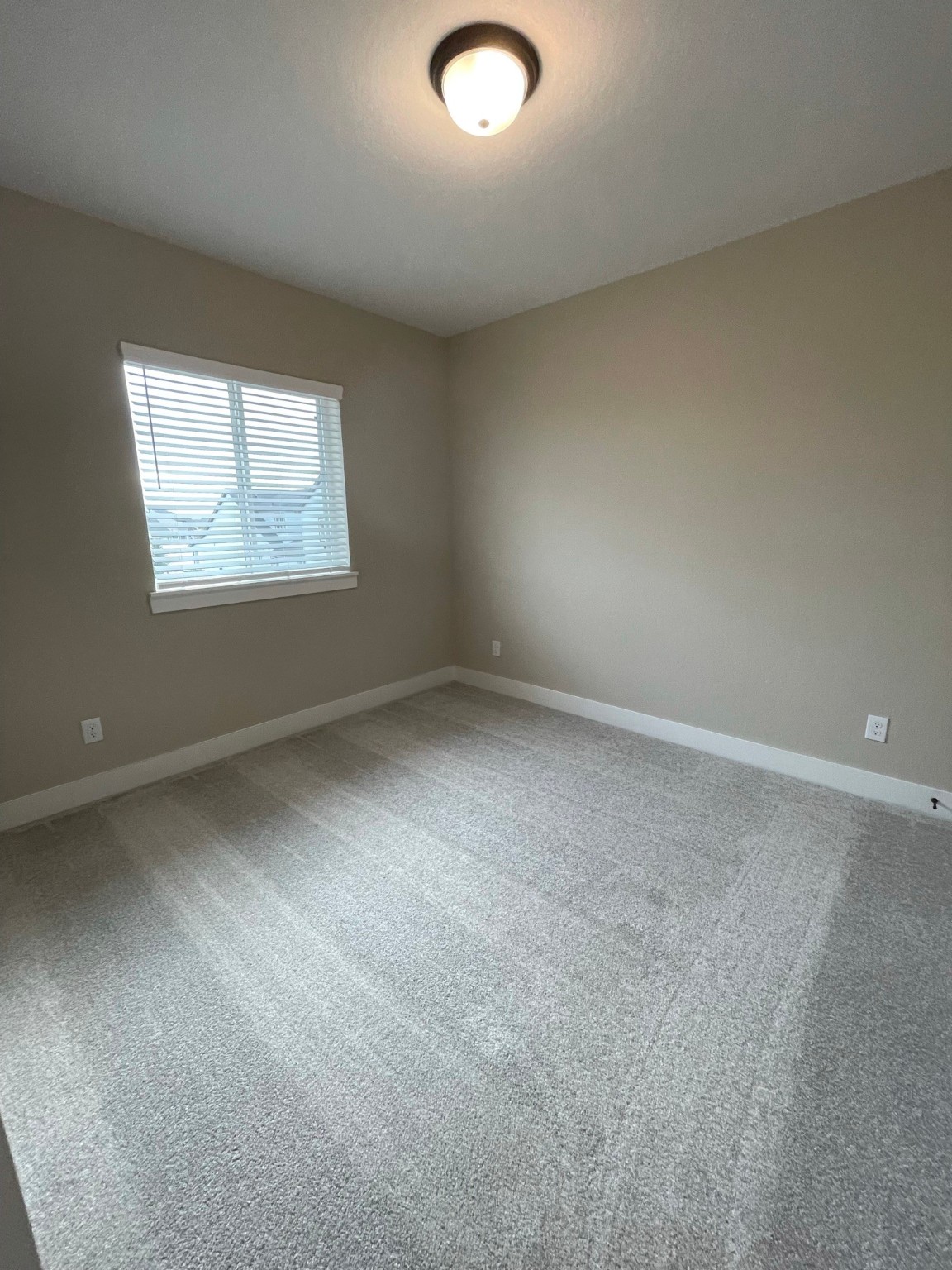 18607 Courteous Way Cypress, TX 77433 - Photo 32 of 37 an empty room with a window