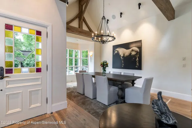 a view of a dining room with furniture window and outside view