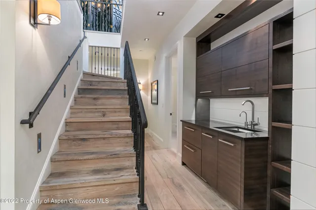a kitchen with granite countertop a refrigerator and a stove