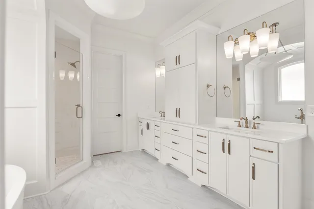 a bathroom with a double vanity sink mirror and