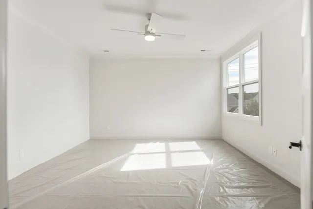 a view of an empty room with a window