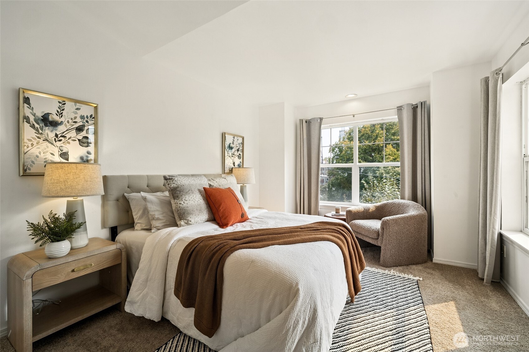 1512 Northwest 57th Street, Unit B Seattle, WA 98107 - Photo 14 of 27 a bed room with a bed and a chair