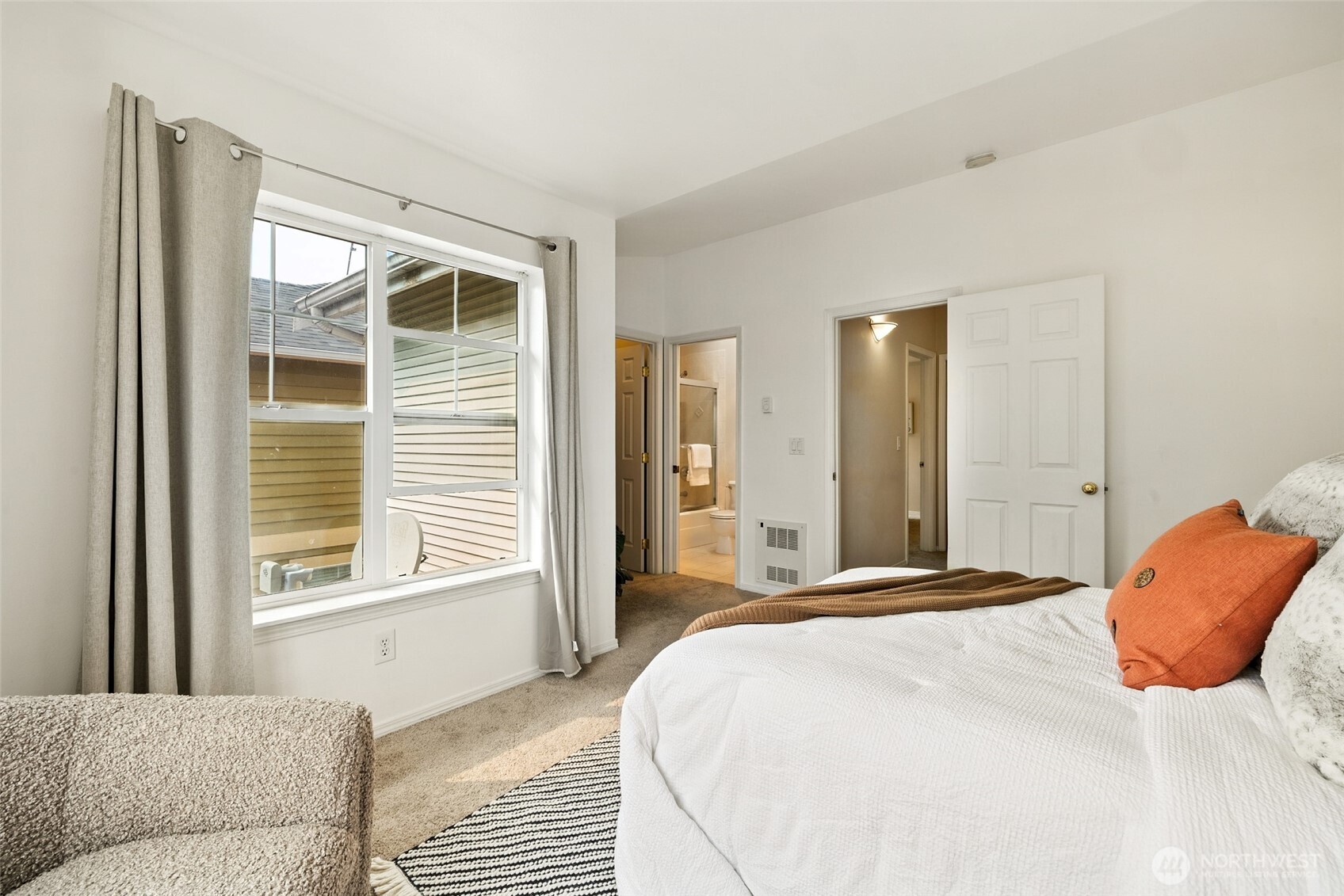 1512 Northwest 57th Street, Unit B Seattle, WA 98107 - Photo 15 of 27 a bedroom with a bed and a window