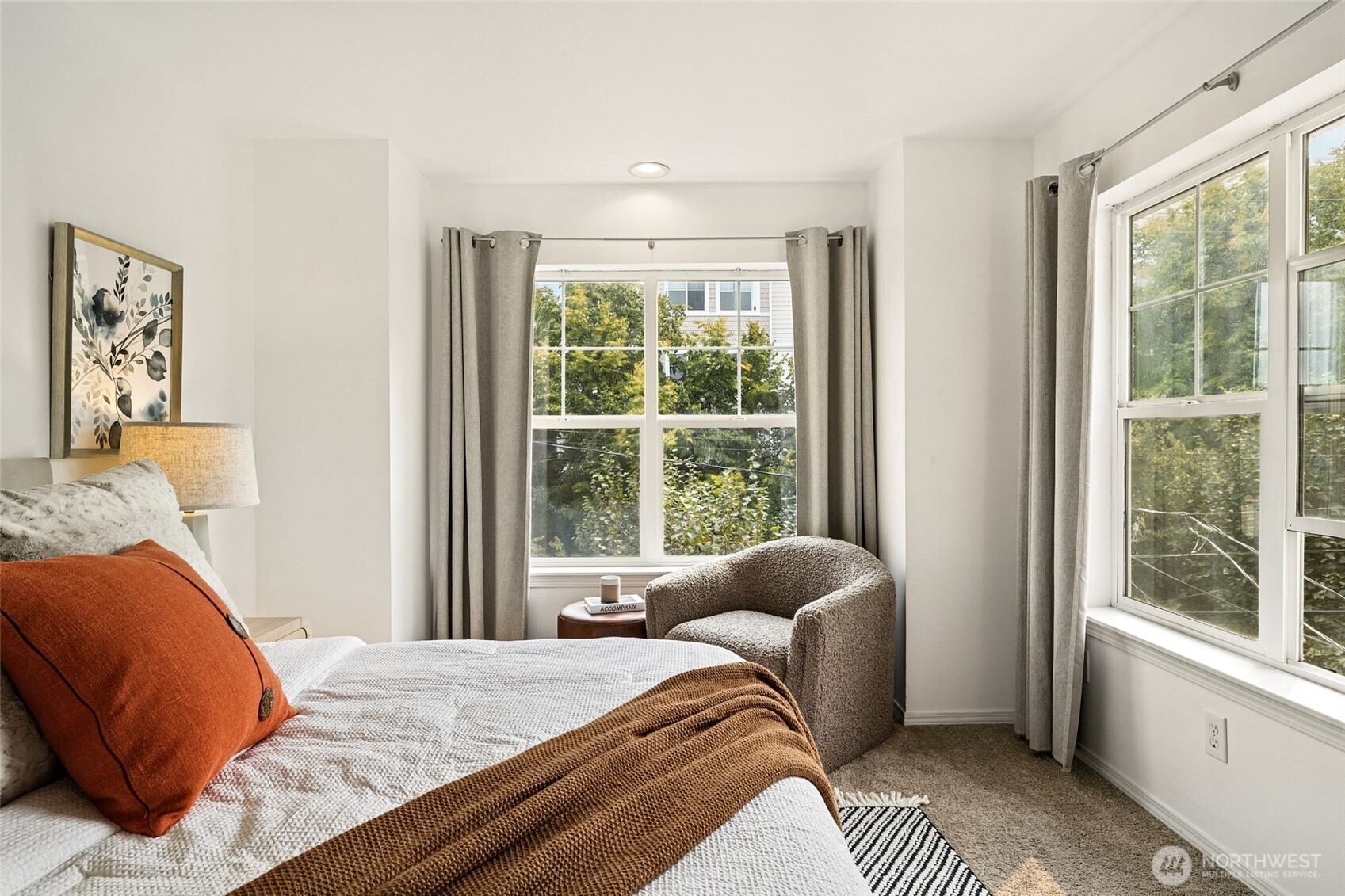 1512 Northwest 57th Street, Unit B Seattle, WA 98107 - Photo 17 of 27 a bedroom with a bed and a window with outer view