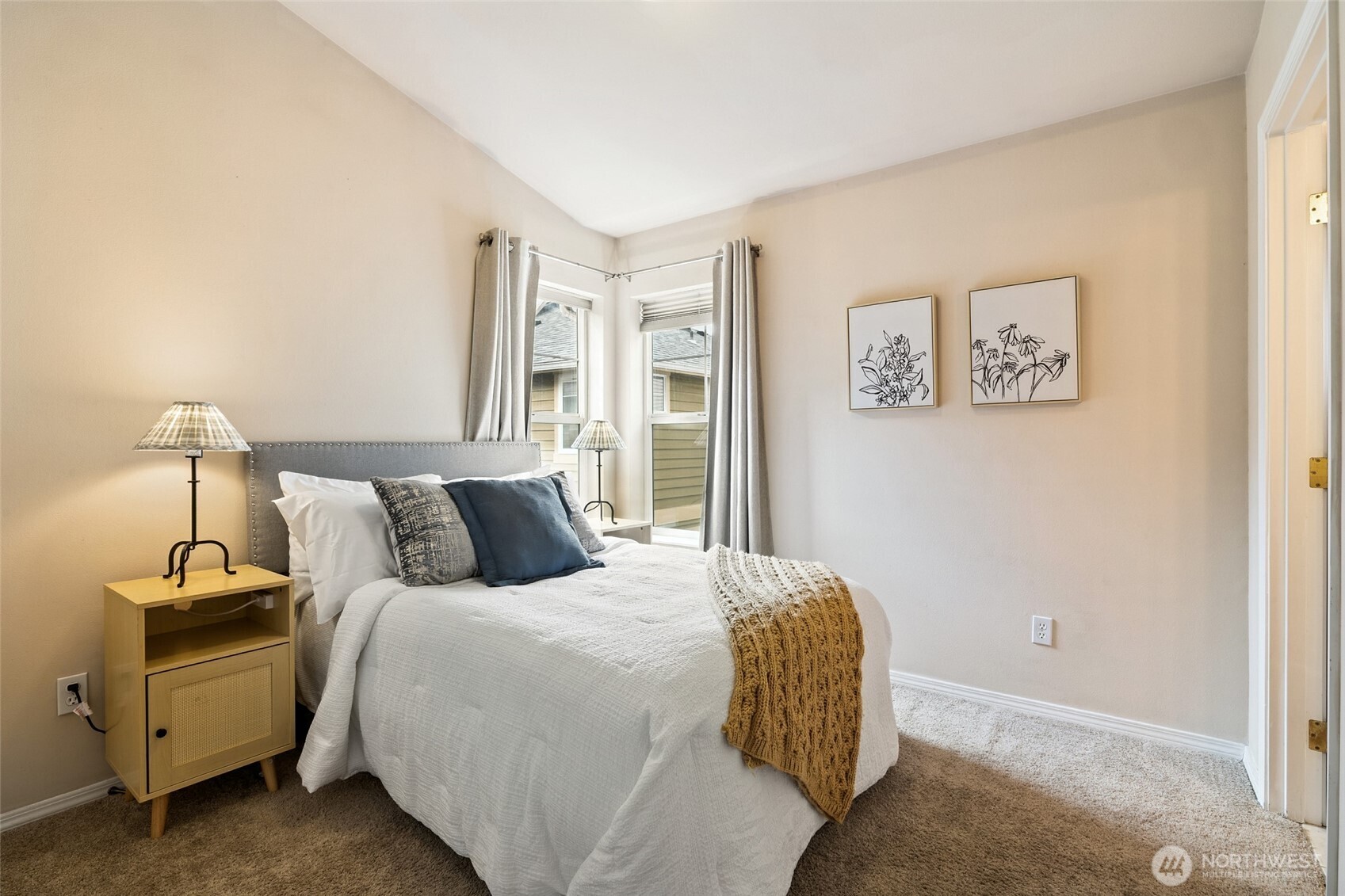 1512 Northwest 57th Street, Unit B Seattle, WA 98107 - Photo 18 of 27 a bedroom with a bed and a night stand