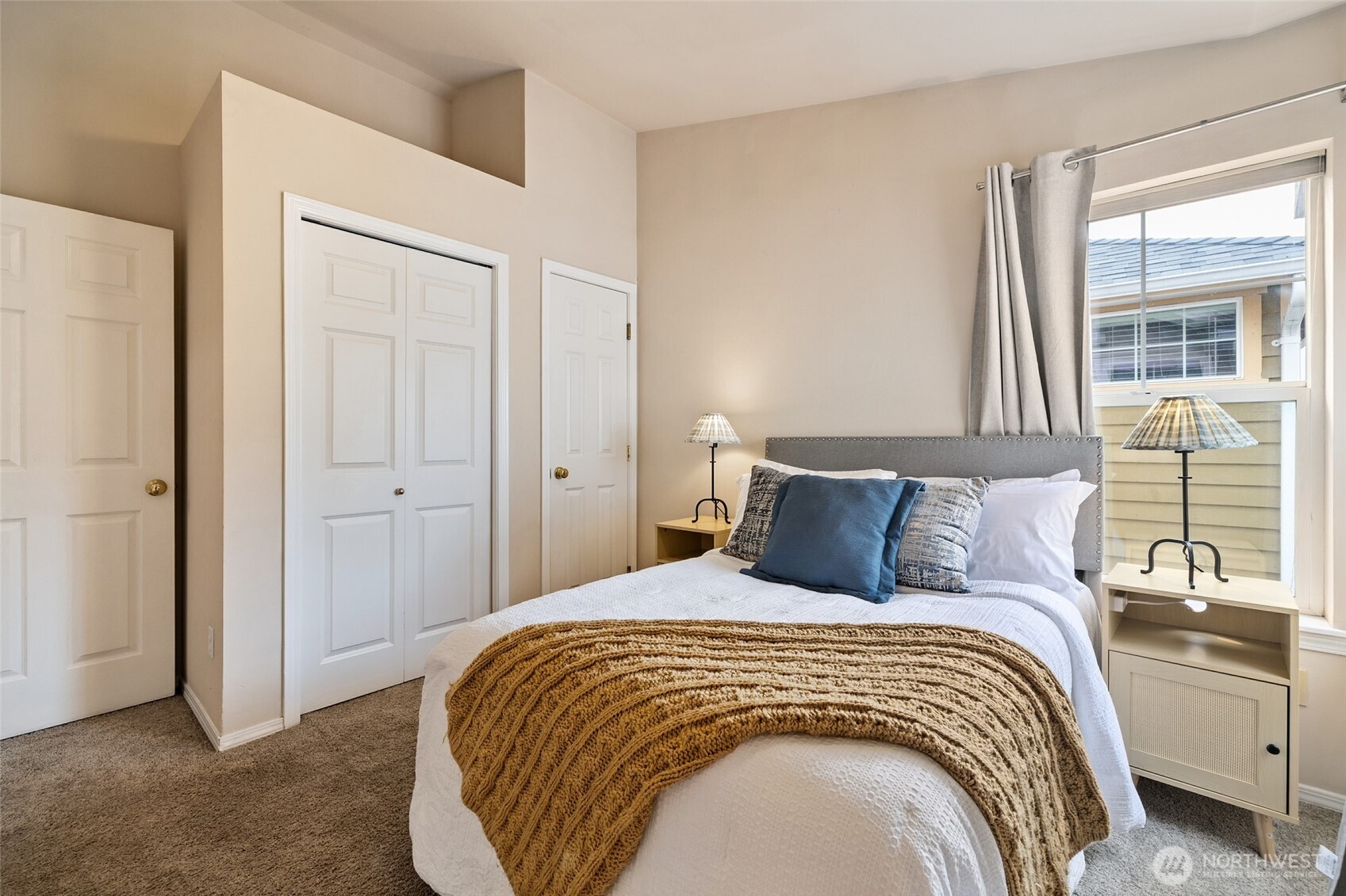 1512 Northwest 57th Street, Unit B Seattle, WA 98107 - Photo 19 of 27 a bedroom with a bed and a window