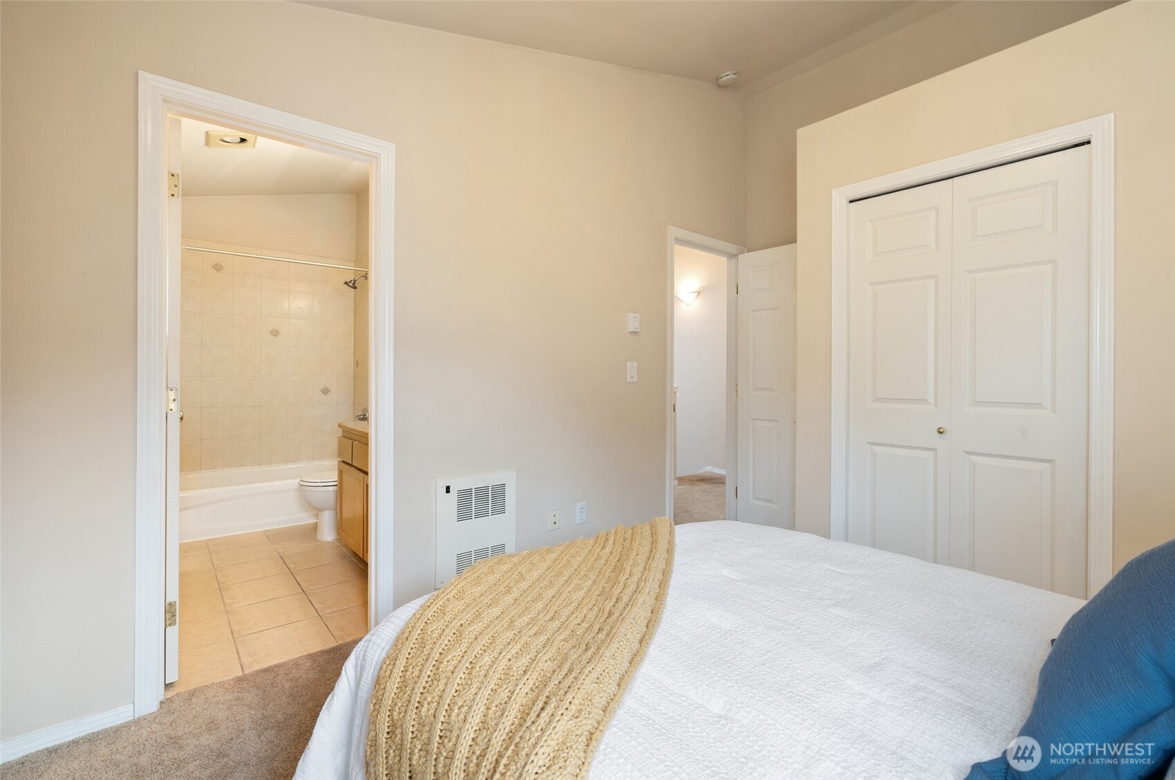 1512 Northwest 57th Street, Unit B Seattle, WA 98107 - Photo 20 of 27 a bedroom with a bed and hallway