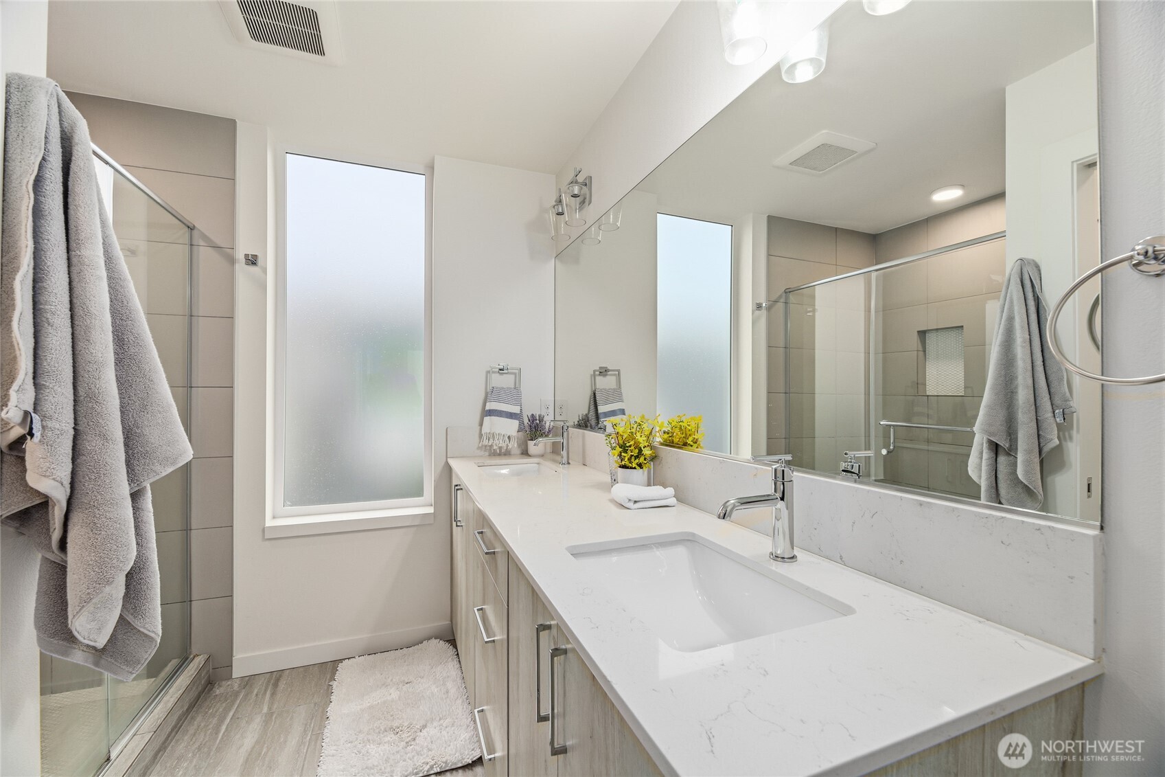 437 Northeast 73rd Street, Unit B Seattle, WA 98115 - Photo 11 of 21 a bathroom with a sink double vanity and a mirror