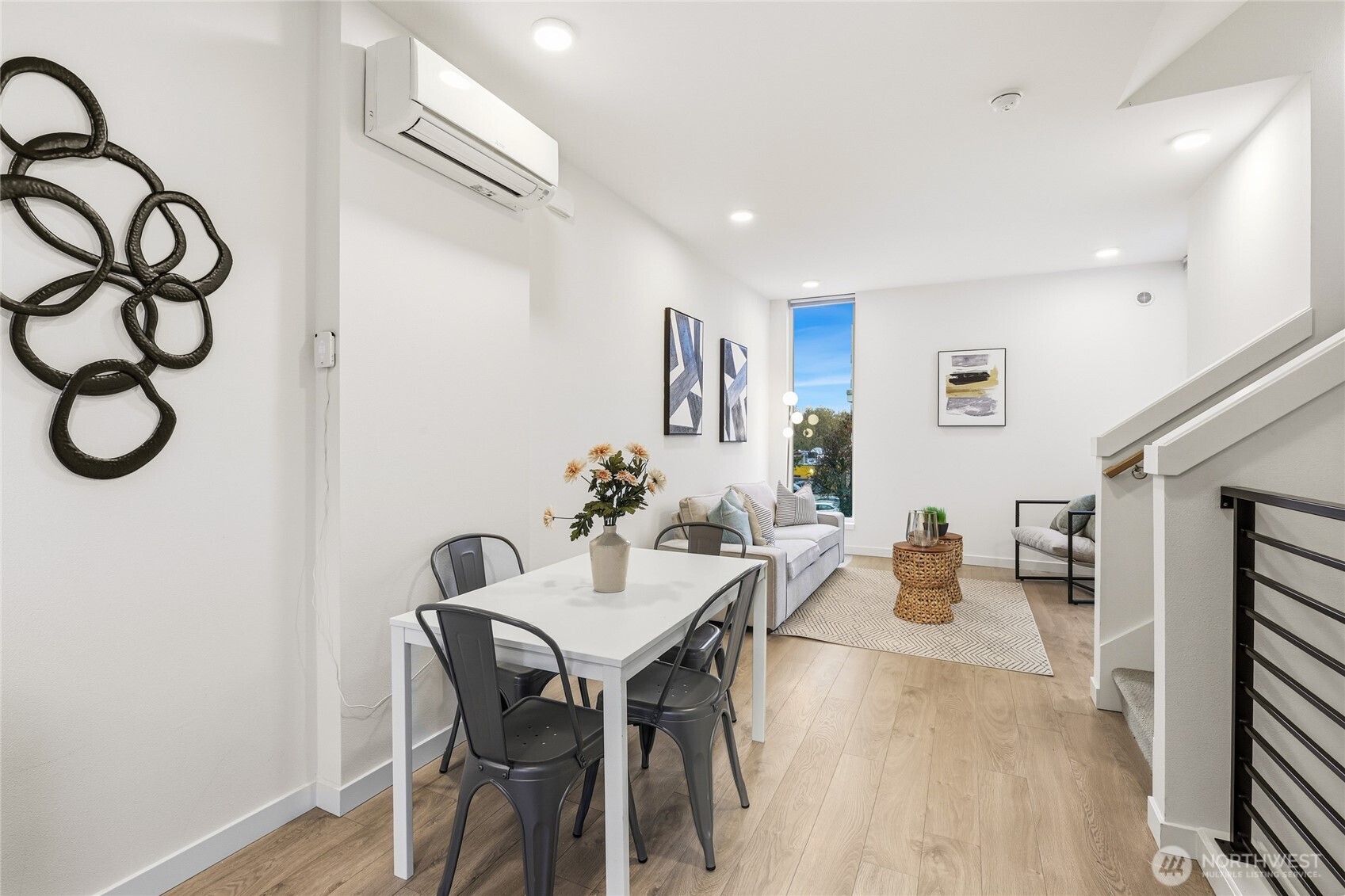 437 Northeast 73rd Street, Unit B Seattle, WA 98115 - Photo 6 of 21 a view of a dining room with furniture and a chandelier