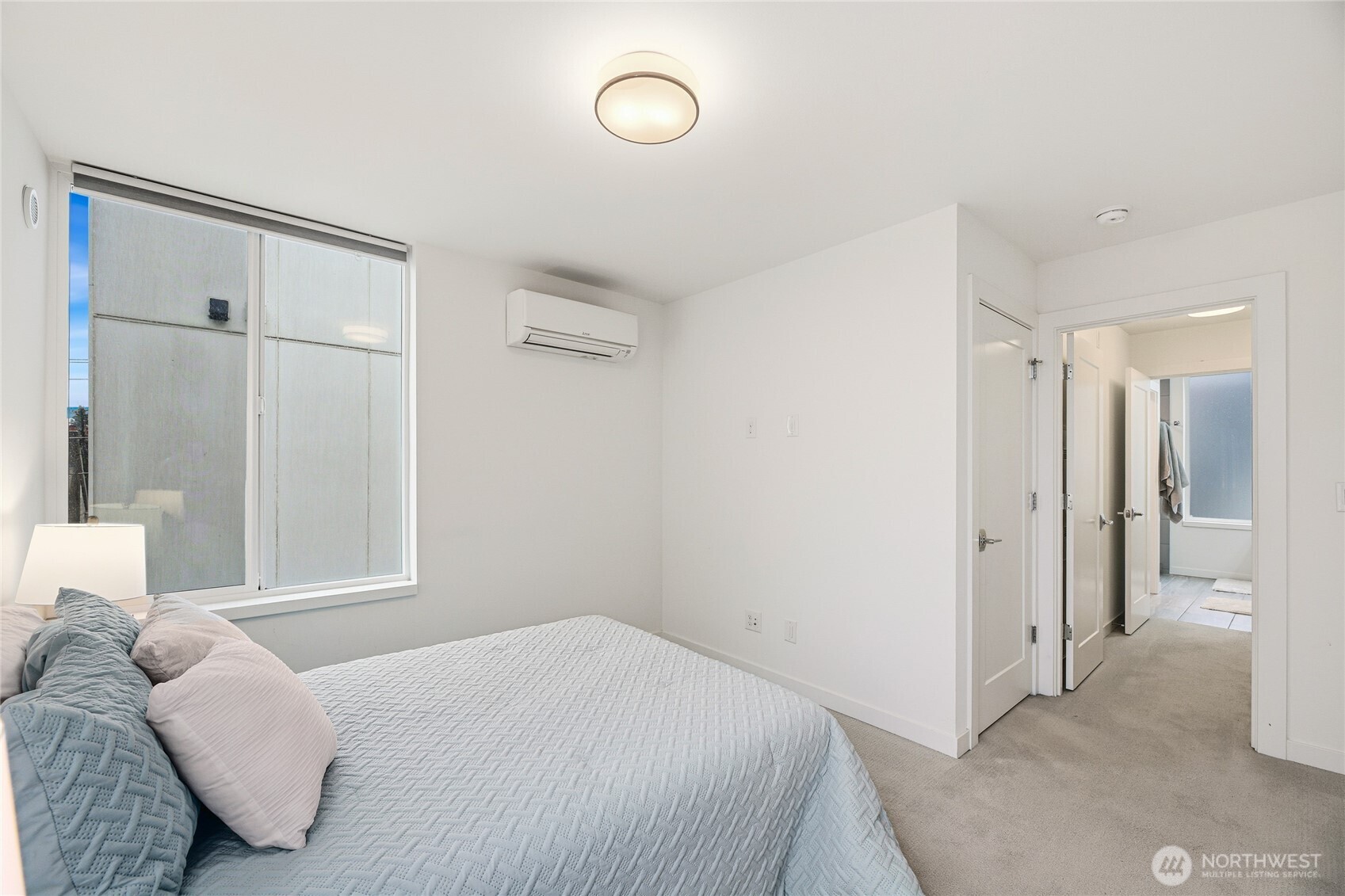 437 Northeast 73rd Street, Unit B Seattle, WA 98115 - Photo 10 of 21 a bedroom with a bed and a window