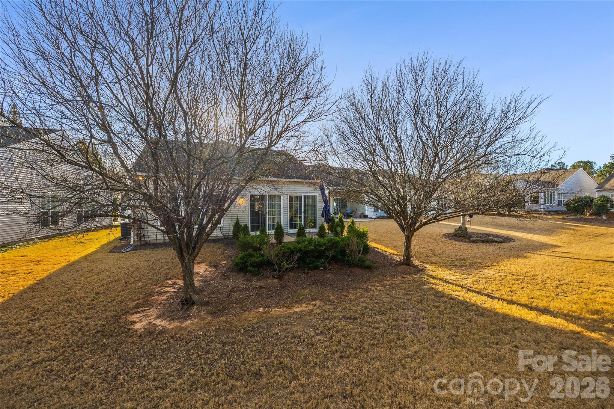 2227 Lilac Lane Fort Mill, SC 29707 - Photo 25 of 42 a view of a yard with a house and a large tree