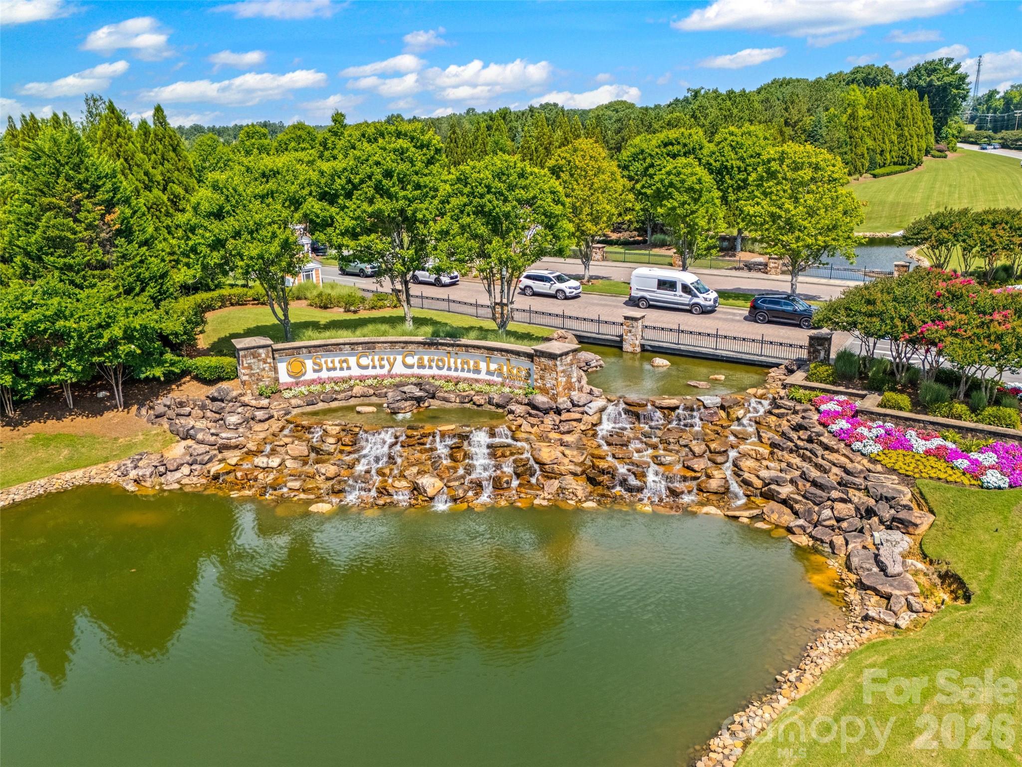 2227 Lilac Lane Fort Mill, SC 29707 - Photo 27 of 42 a view of swimming pool with outdoor seating and lake view