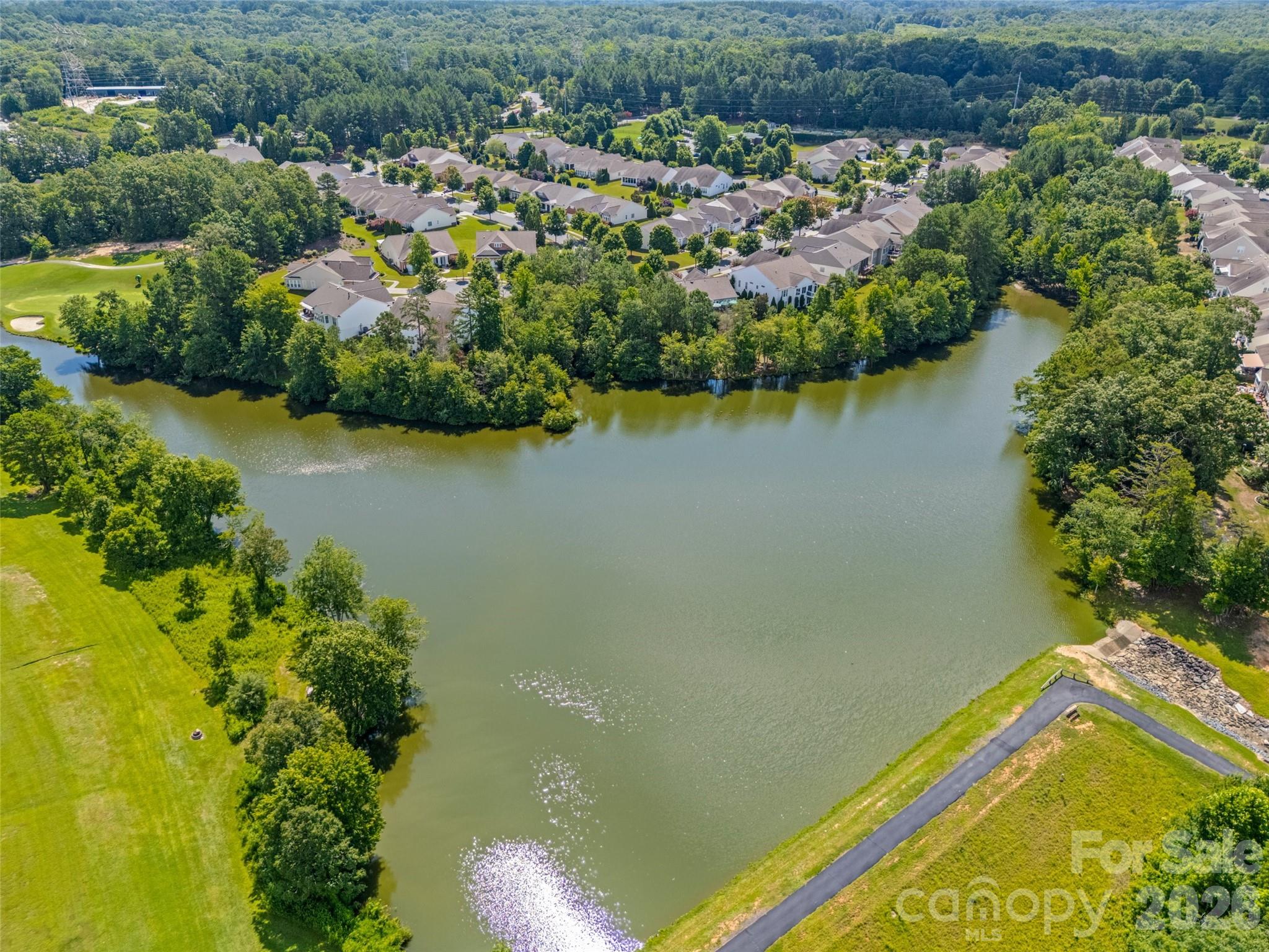 2227 Lilac Lane Fort Mill, SC 29707 - Photo 31 of 42 an aerial view of a house with a yard and lake view