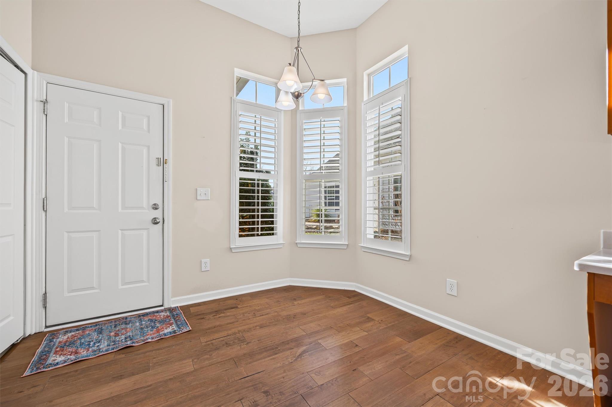 2227 Lilac Lane Fort Mill, SC 29707 - Photo 8 of 42 a view of a livingroom with wooden floor and a window