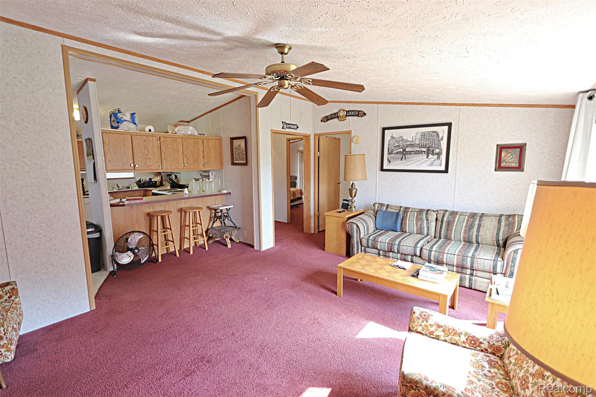 11365 Littlefield Road Blanchard, MI 49310 - Photo 45 of 68 Open concept living area with ceiling fan and direct access to the kitchen