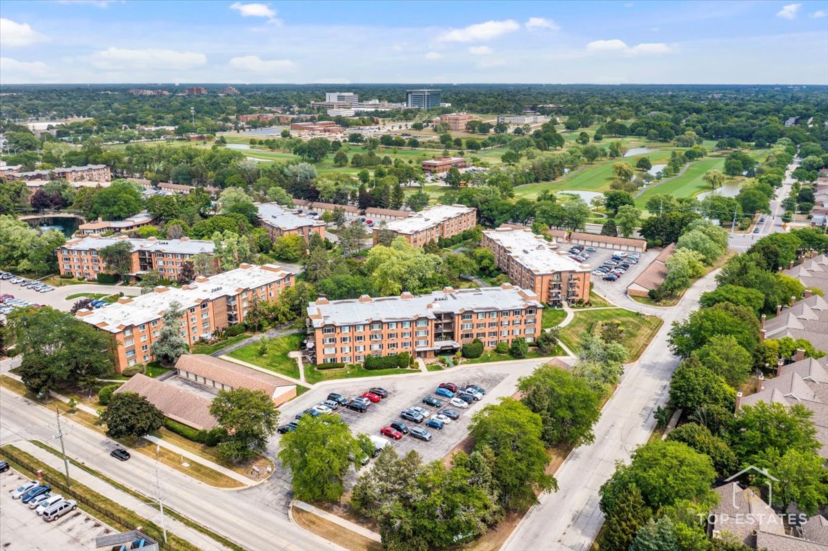 1227 South Old Wilke Road, Unit 201 Rolling Meadows, IL 60005 - Photo 2 of 40 an aerial view of residential houses with outdoor space