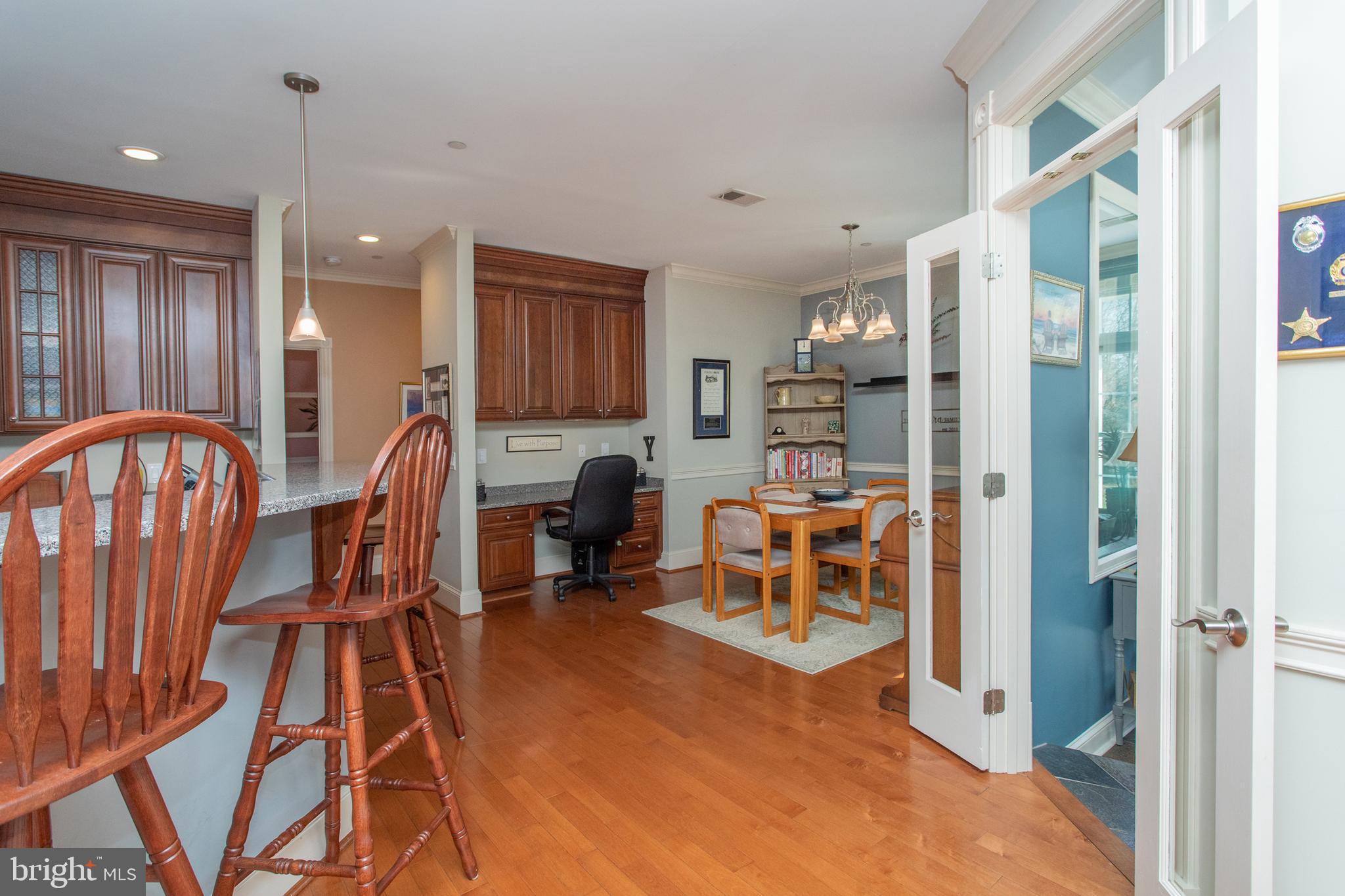 6901 Accokeek Road Brandywine, MD 20613 - Photo 17 of 82 a view of a a dining room with furniture window and wooden floor
