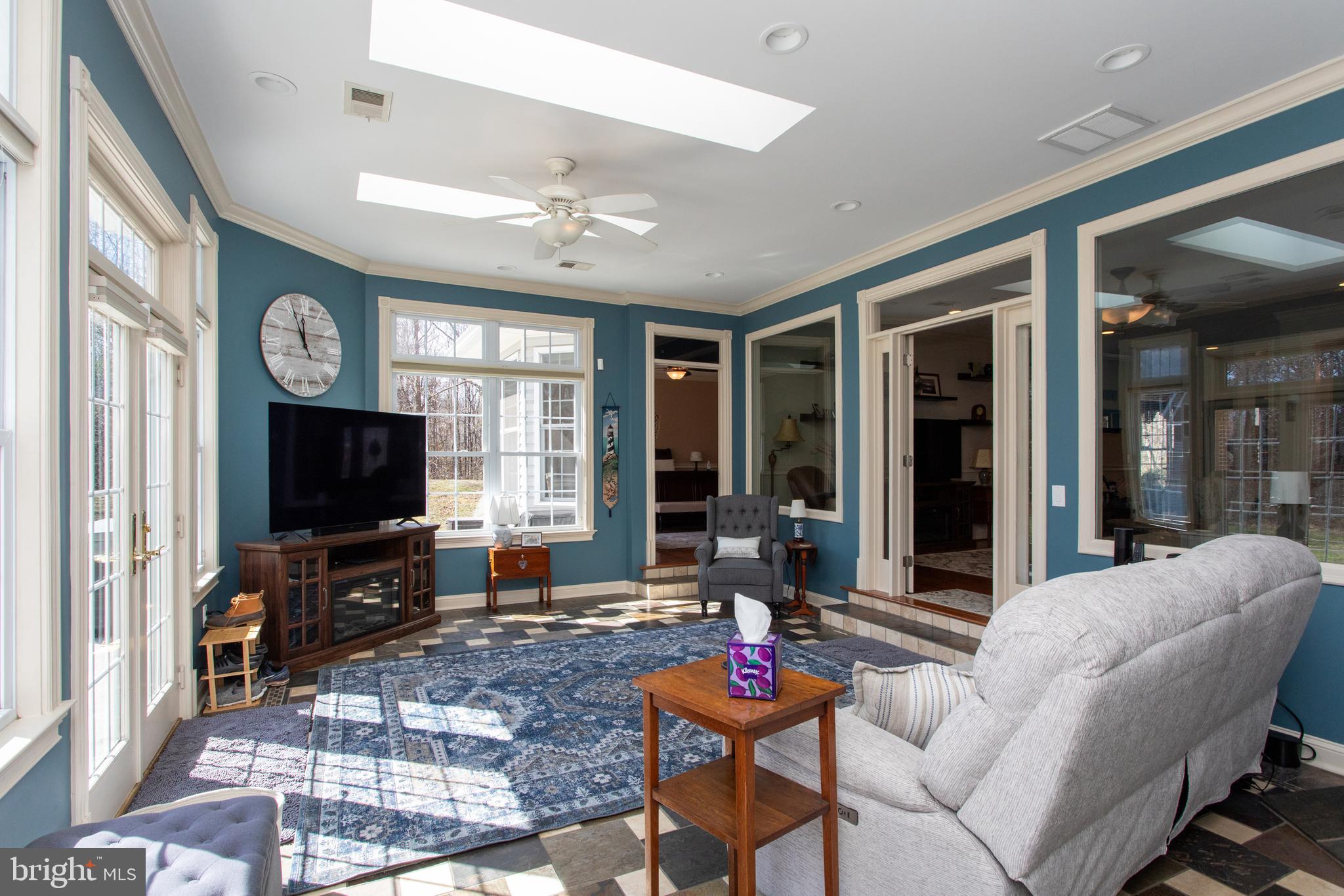 6901 Accokeek Road Brandywine, MD 20613 - Photo 32 of 82 a living room with fireplace furniture and a flat screen tv