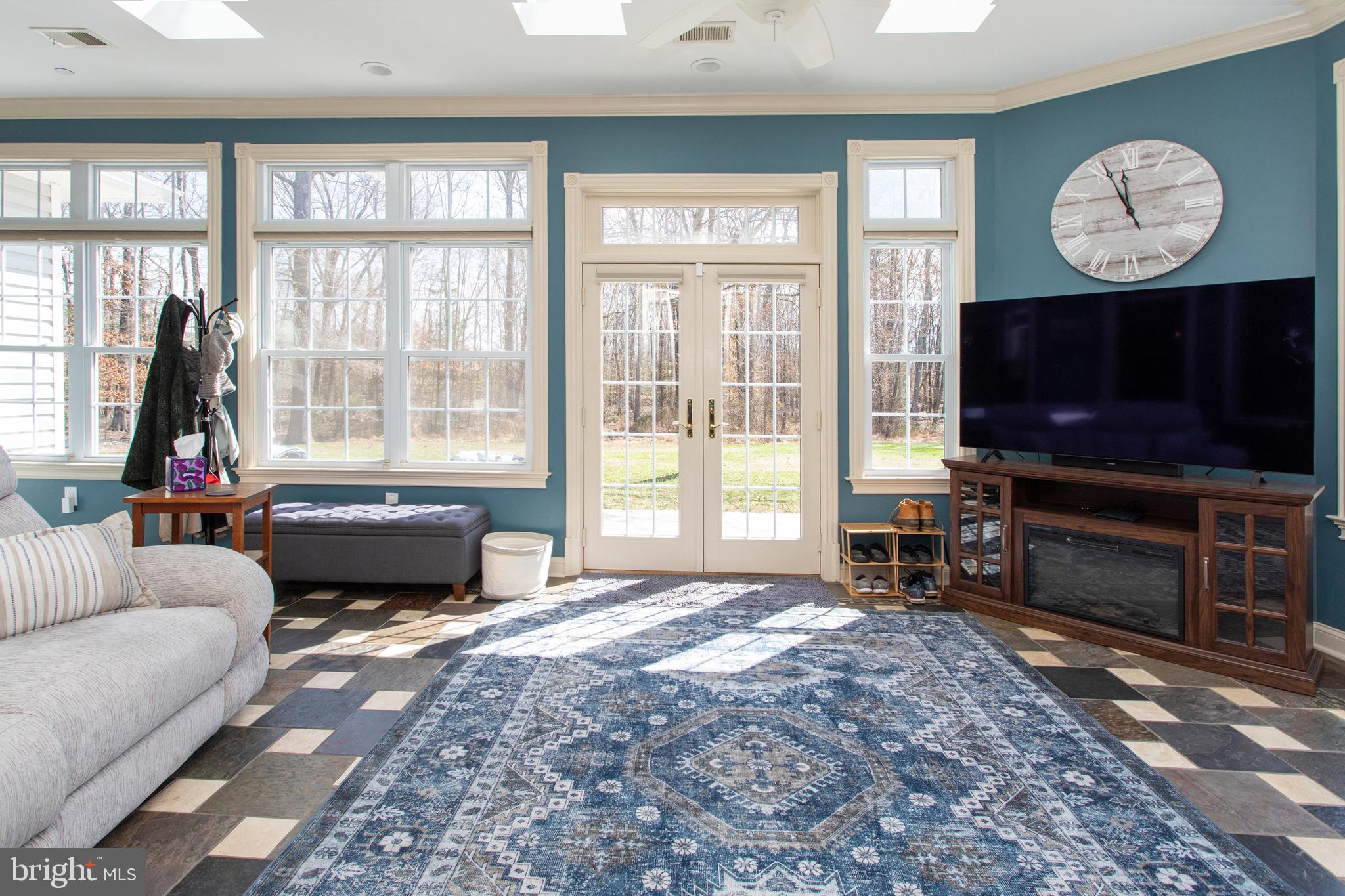 6901 Accokeek Road Brandywine, MD 20613 - Photo 33 of 82 a living room with furniture a flat screen tv and a large window