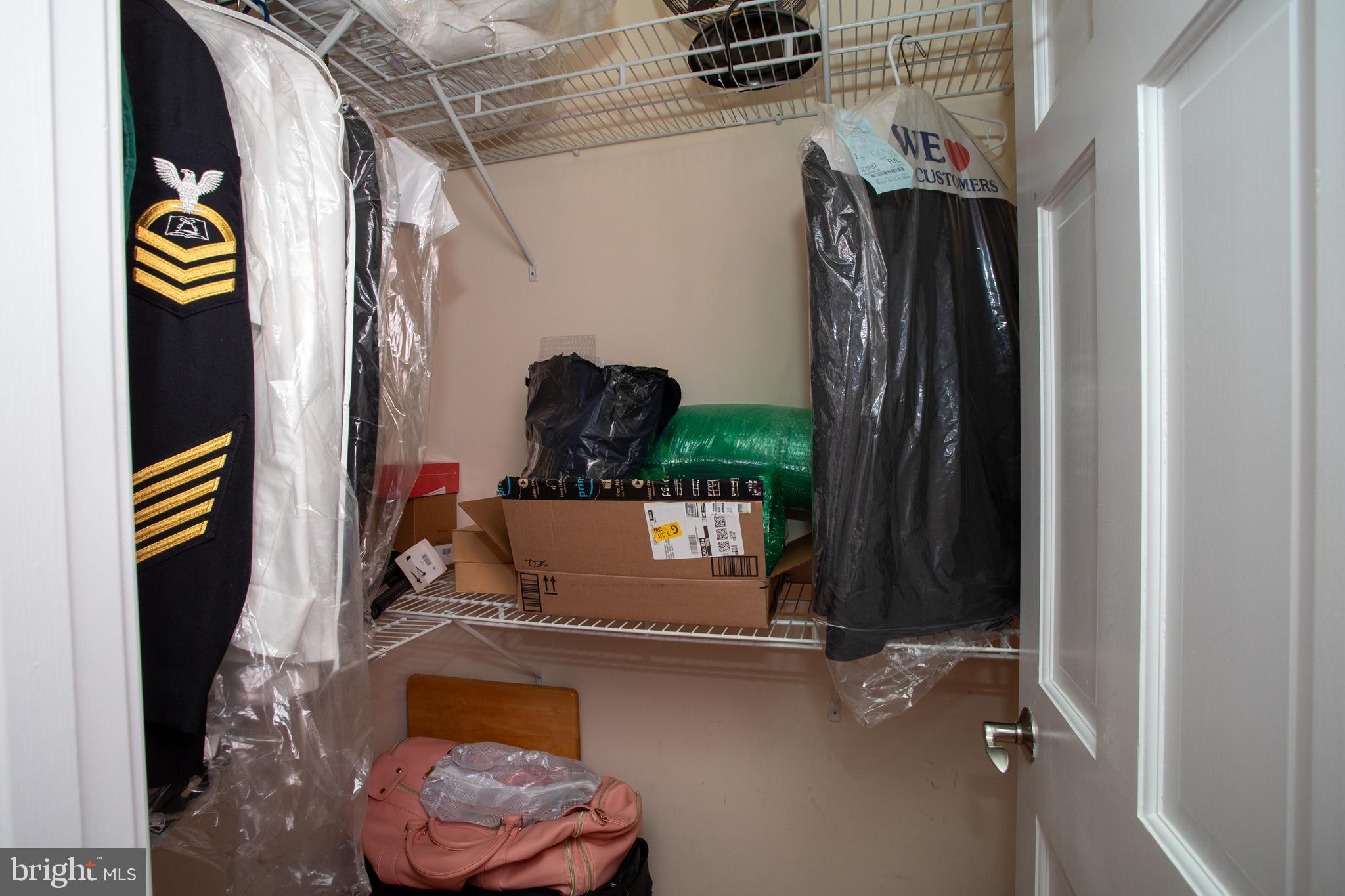 6901 Accokeek Road Brandywine, MD 20613 - Photo 50 of 82 a view of walk in closet with clothes and shoes