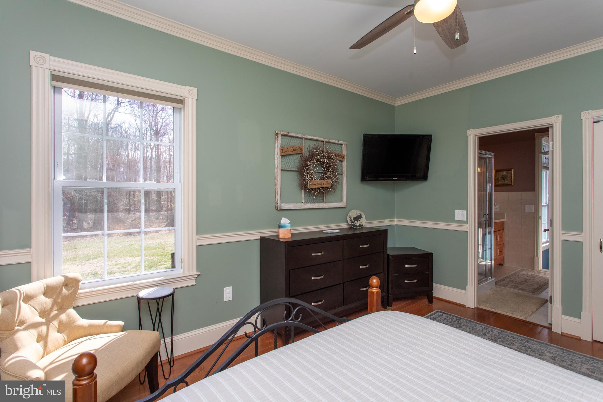 6901 Accokeek Road Brandywine, MD 20613 - Photo 56 of 82 a bedroom with a bed and a flat screen tv