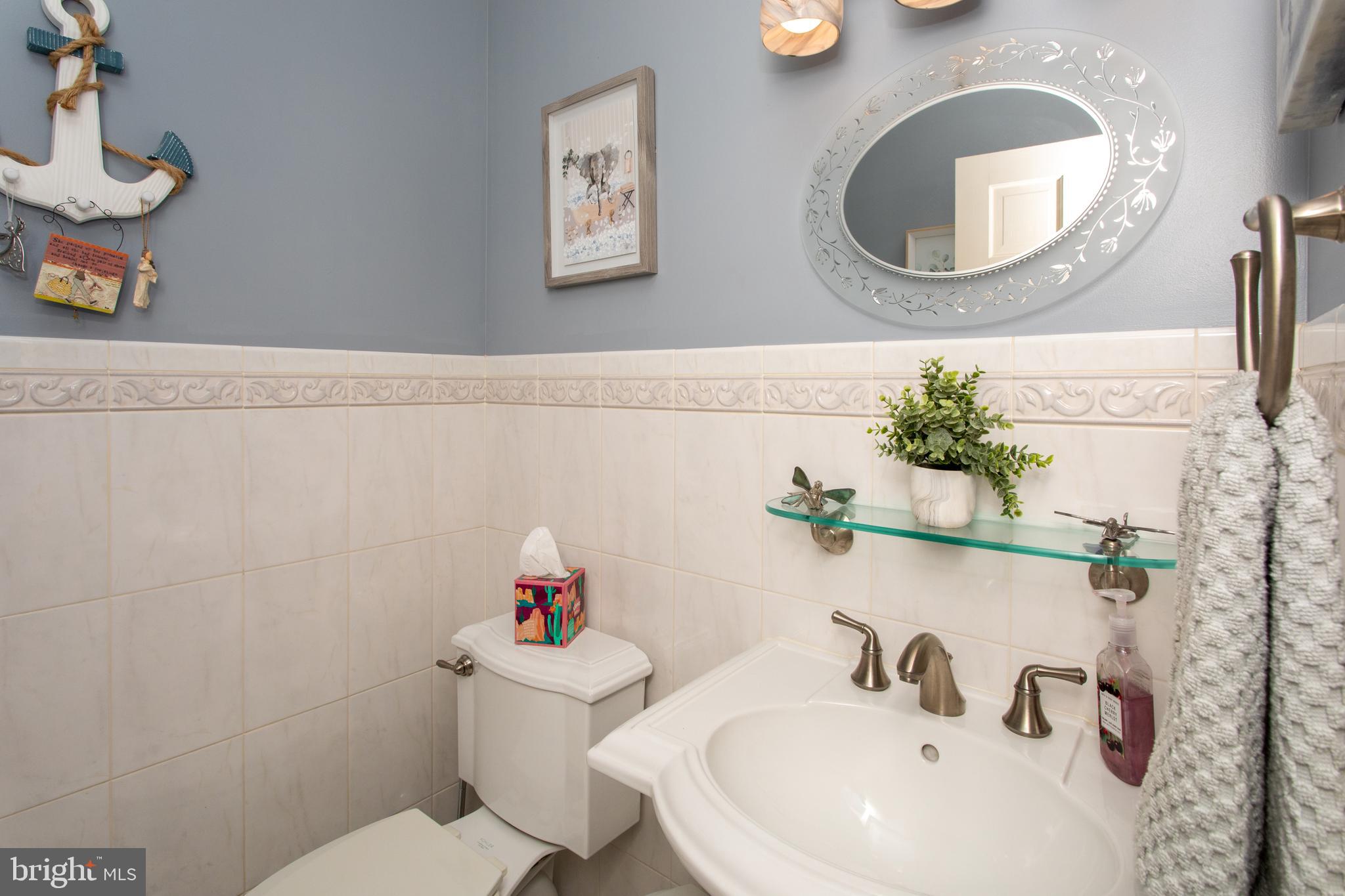 6901 Accokeek Road Brandywine, MD 20613 - Photo 57 of 82 a bathroom with a sink mirror and toilet