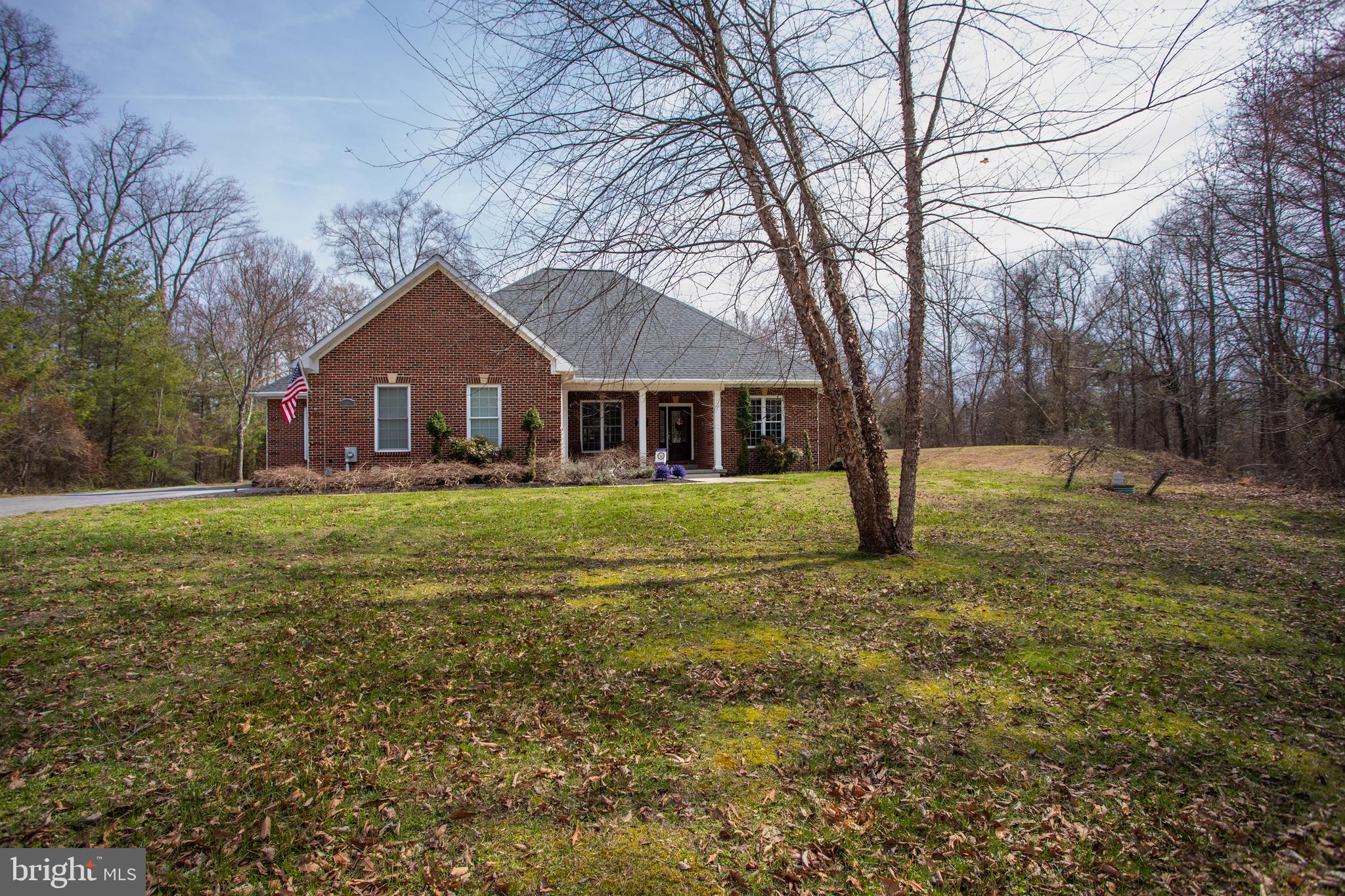 6901 Accokeek Road Brandywine, MD 20613 - Photo 60 of 82 a front view of house with yard and green space