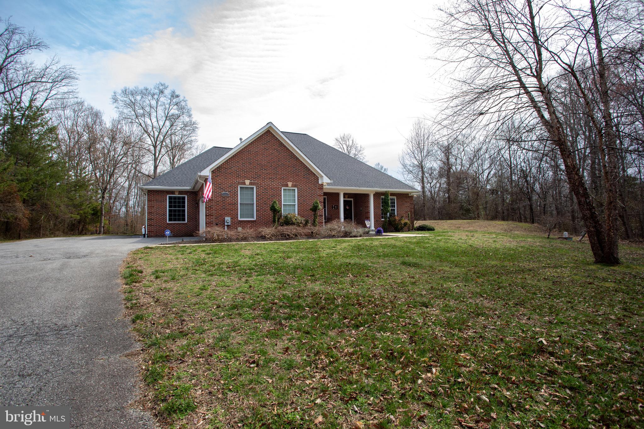 6901 Accokeek Road Brandywine, MD 20613 - Photo 77 of 82 a front view of a house with yard and green space