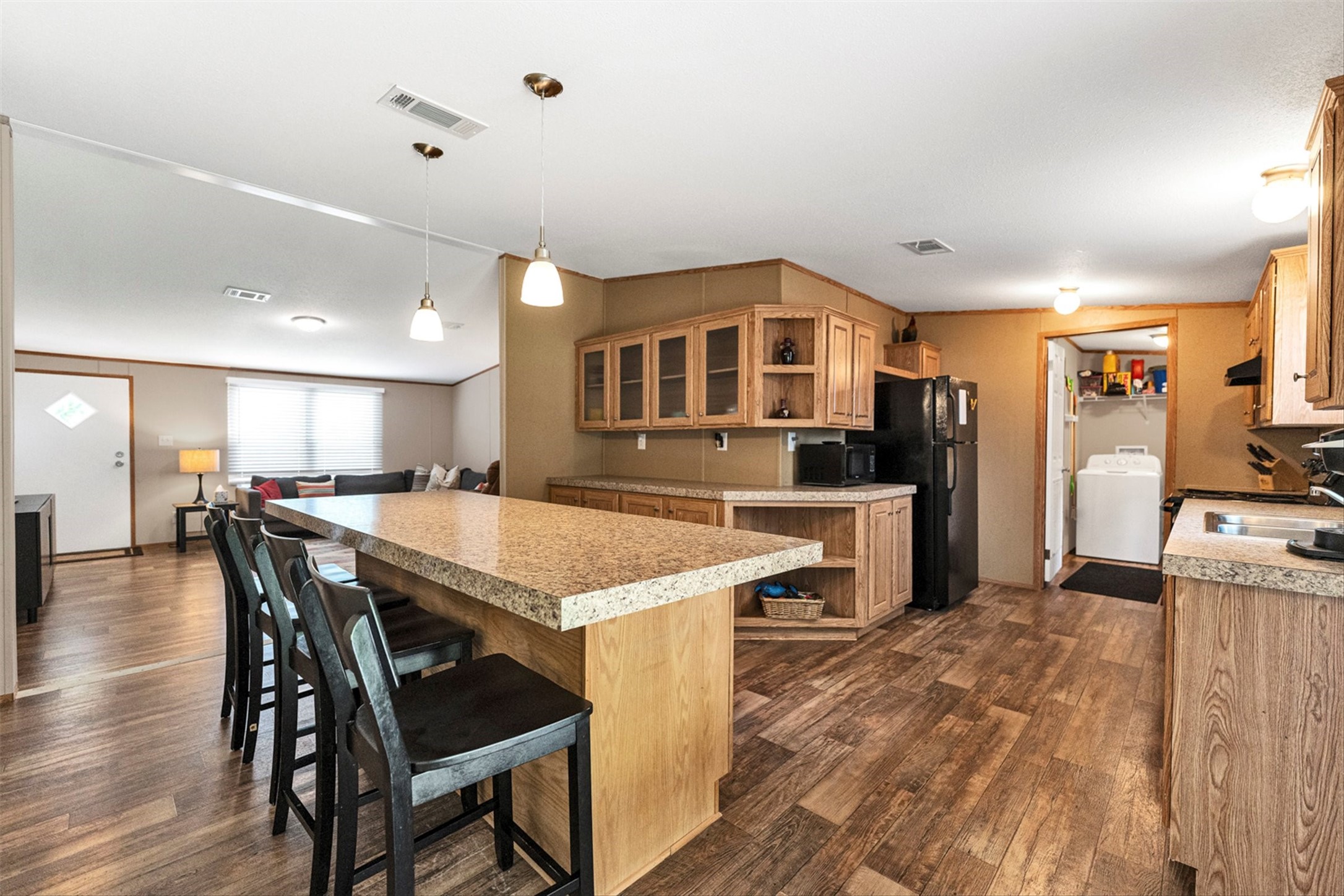 50 Fm 3179 Road Huntsville, TX 77320 - Photo 11 of 45 Dining area flows effortlessly into the kitchen, creating a functional layout perfect for everyday living and entertaining.
