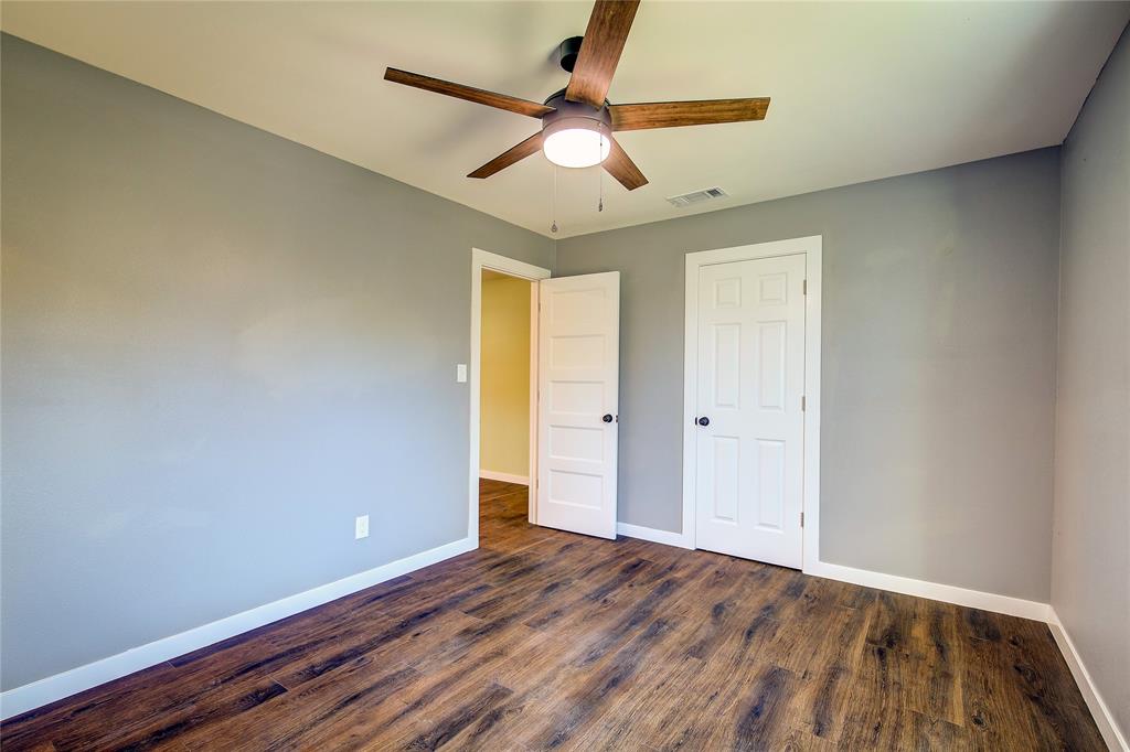 520 North 1st Street Point, TX 75472 - Photo 24 of 34 a view of room with window and wooden floor