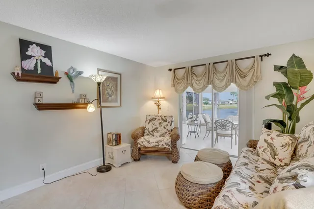 a bedroom with furniture and a potted plant