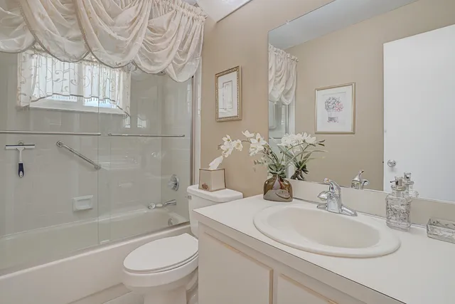 a bathroom with a sink a toilet and a bathtub