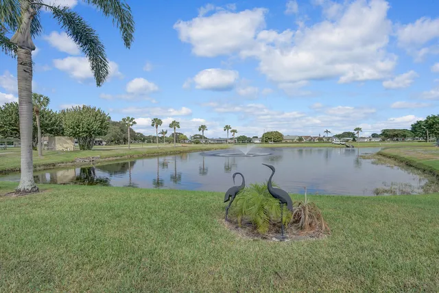 a view of a lake with houses in the back